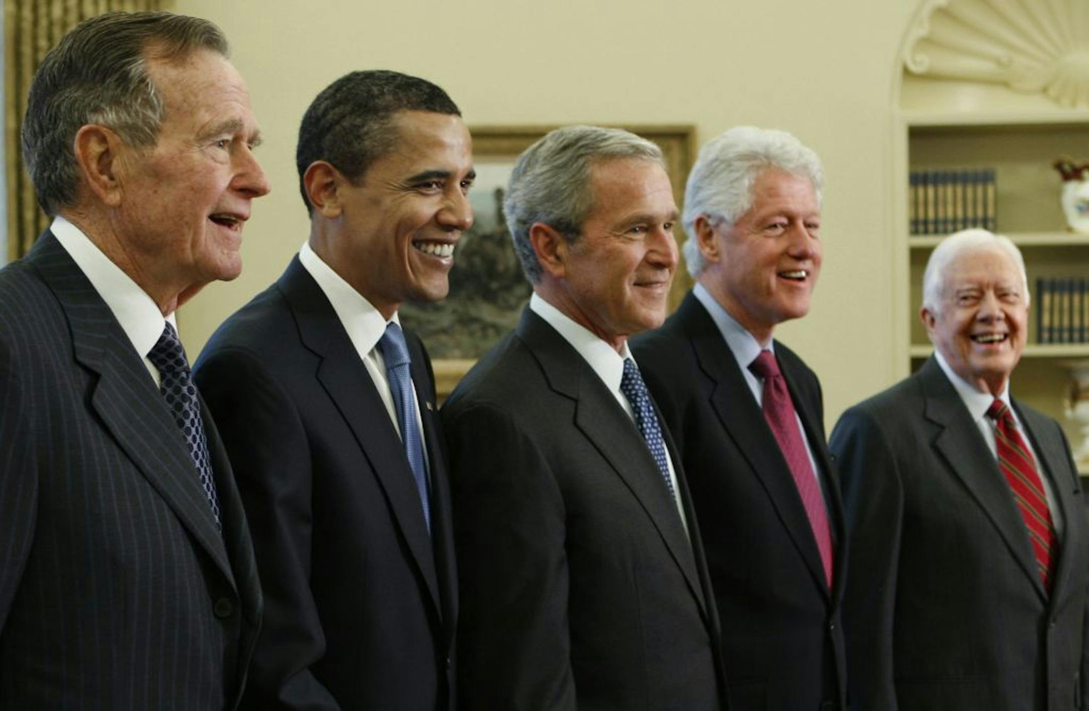 President George W. Bush, center, poses with President-elect Barack Obama, and former presidents, from left, George H.W. Bush, left, Bill Clinton and Jimmy Carter, right, Wednesday, Jan. 7, 2009, in the Oval Office of the White House in Washington.