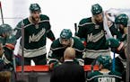 Minnesota Wild defenseman Marco Scandella (6) and right wing Nino Niederreiter (22) listen to head coach Mike Yeo during the third period of Game 3 in