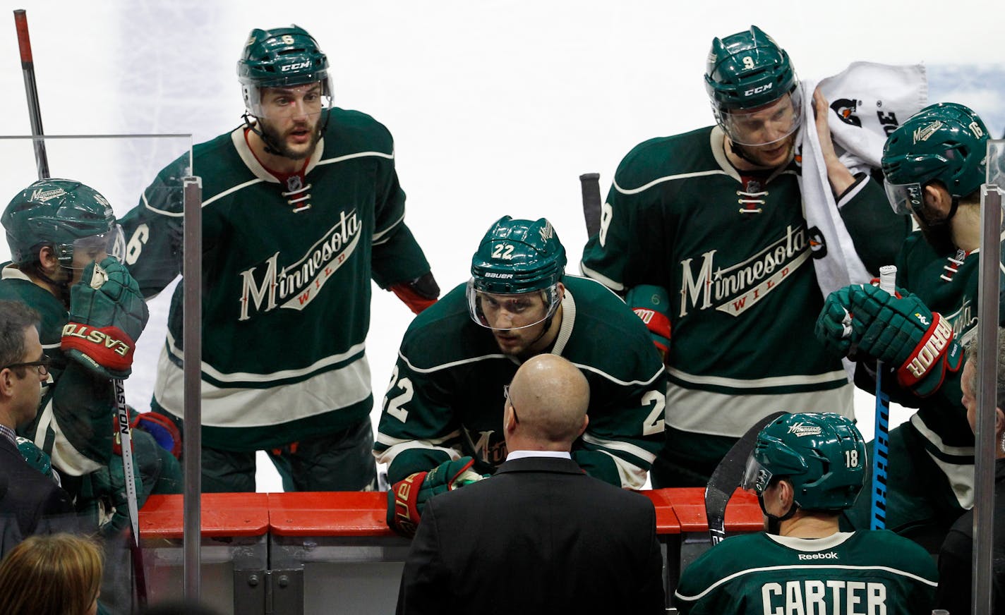 Minnesota Wild defenseman Marco Scandella (6) and right wing Nino Niederreiter (22) listen to head coach Mike Yeo during the third period of Game 3 in the second round of the NHL Stanley Cup hockey playoffs against the Chicago Blackhawks in St. Paul, Minn., Tuesday, May 5, 2015. The Blackhawks won 1-0. (AP Photo/Ann Heisenfelt)