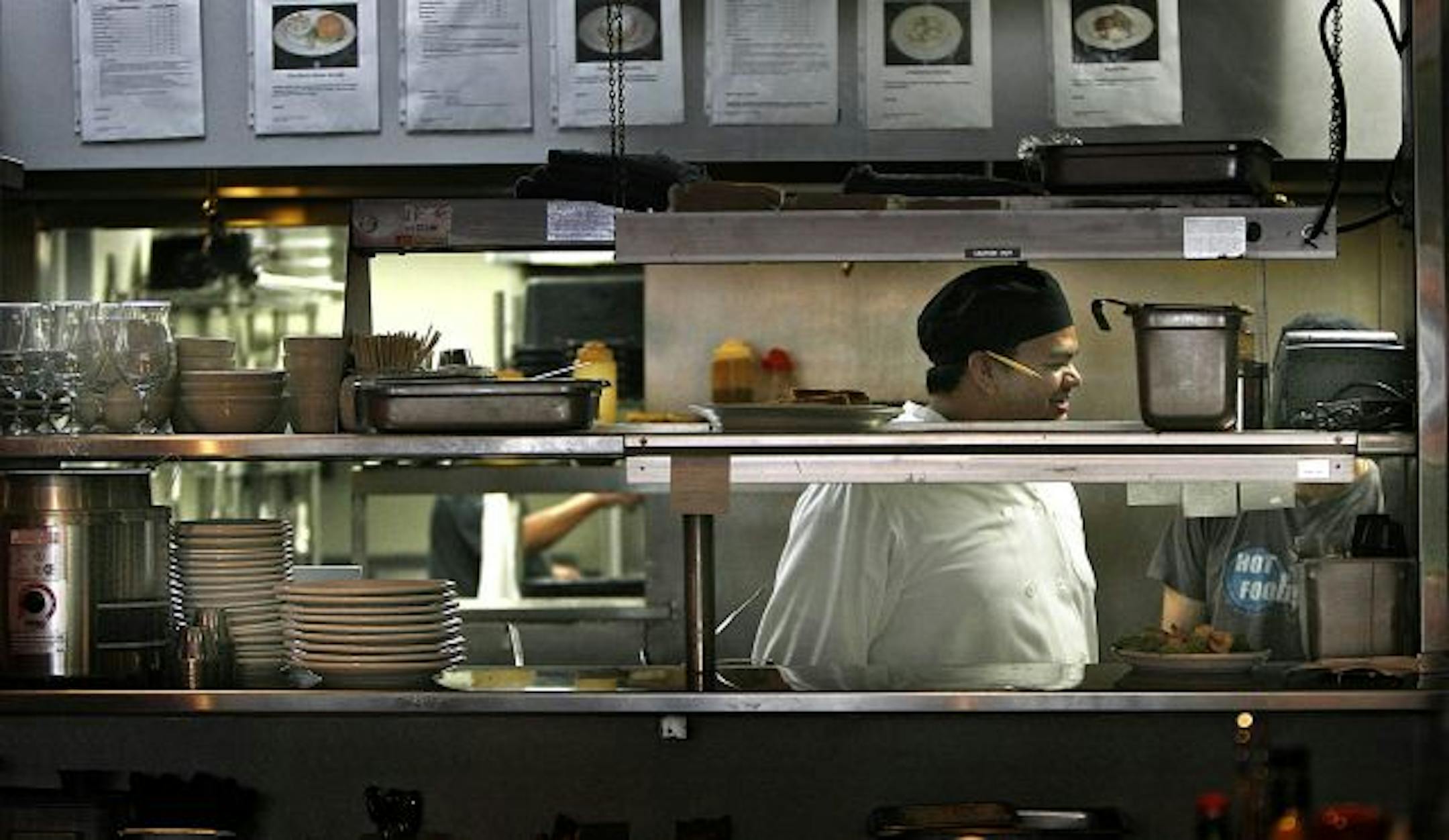 Chef Luis Carrillo prepared for lunchtime Friday at the Highland Grill in St. Paul. One of the practices the restaurant uses to avoid food allergy incidents is to have the servers find out whether special food requests are related to allergies. If so, the meal will be prepared separately.