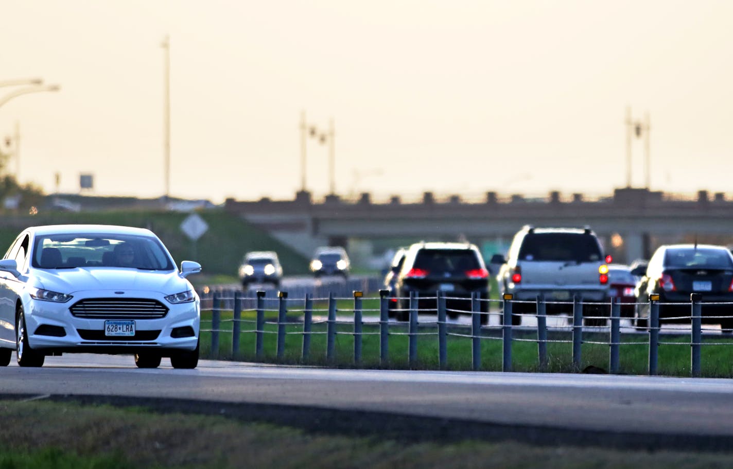 This photo shows traffic along Hwy. 10 just south of Main St. in Coon Rapids, MN. Between the traffic lanes one can see the cable median fence. ... as motorists head north or elsewhere for the Memorial weekend, some may notice the lowly cable median fences strung along almost 400 miles of Minnesota highways. The short cable fences, at minimal cost, are making travel safer for motorists by preventing careening vehicles from crossing medians into oncoming traffic. The cable barriers have been struck more than 440 times since 2009, when crash statistics began to be collected by the state Department of Transportation. ] David Denney ddenney@startribune.com STAR TRIBUNE 052114 Coon Rapids, MN SAXO 126741