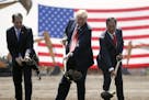 FILE - In this June 28, 2018, file photo, President Donald Trump, center, Wisconsin Gov. Scott Walker, left, and Foxconn Chairman Terry Gou, right, pa