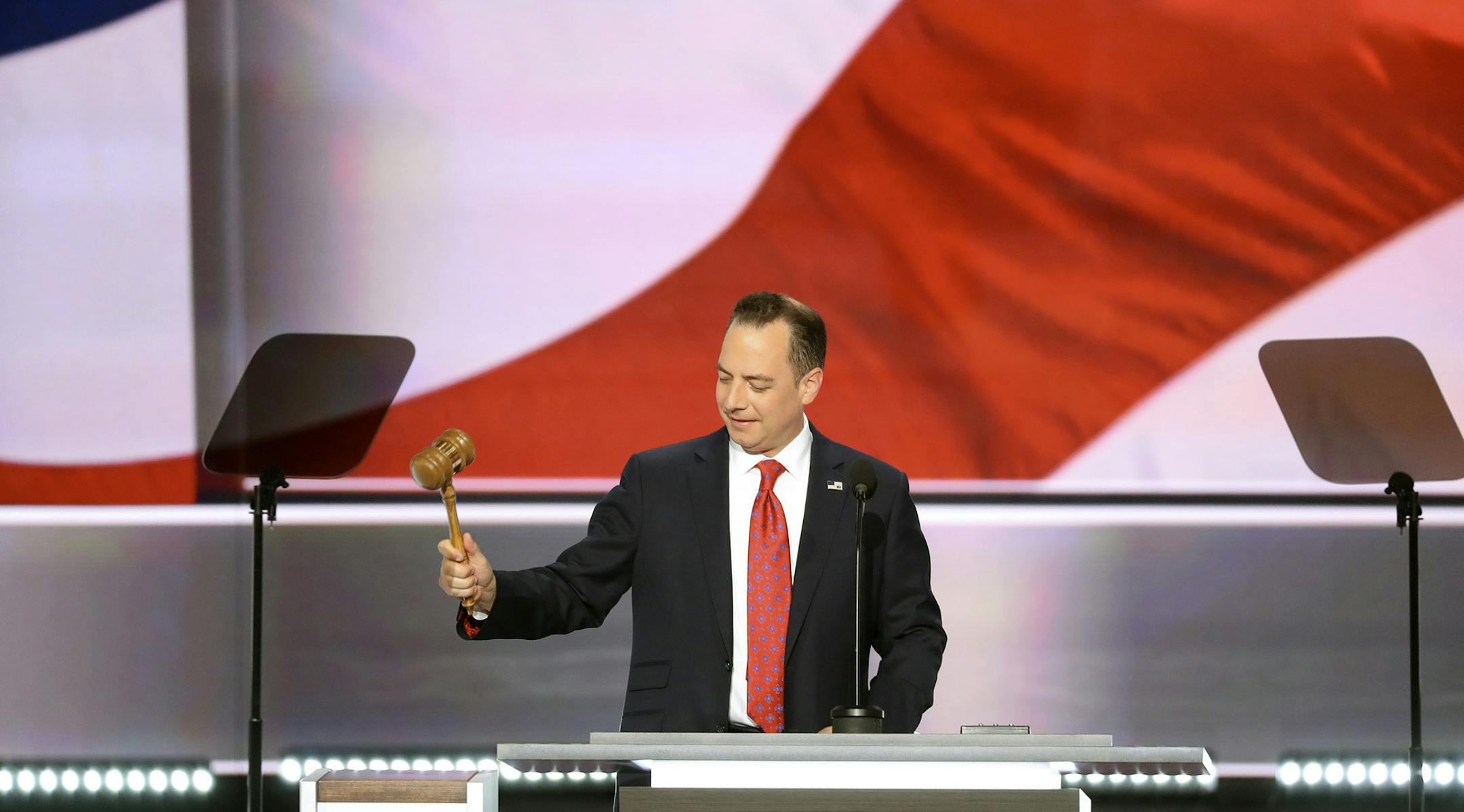 Reince Priebus, chair of the Republican National Committee, bangs a gavel at the start of the Republican National Convention at the Quicken Loans Arena in Cleveland, July 18, 2016. (Chang W. Lee/The New York Times) ORG XMIT: MIN2016071813250355