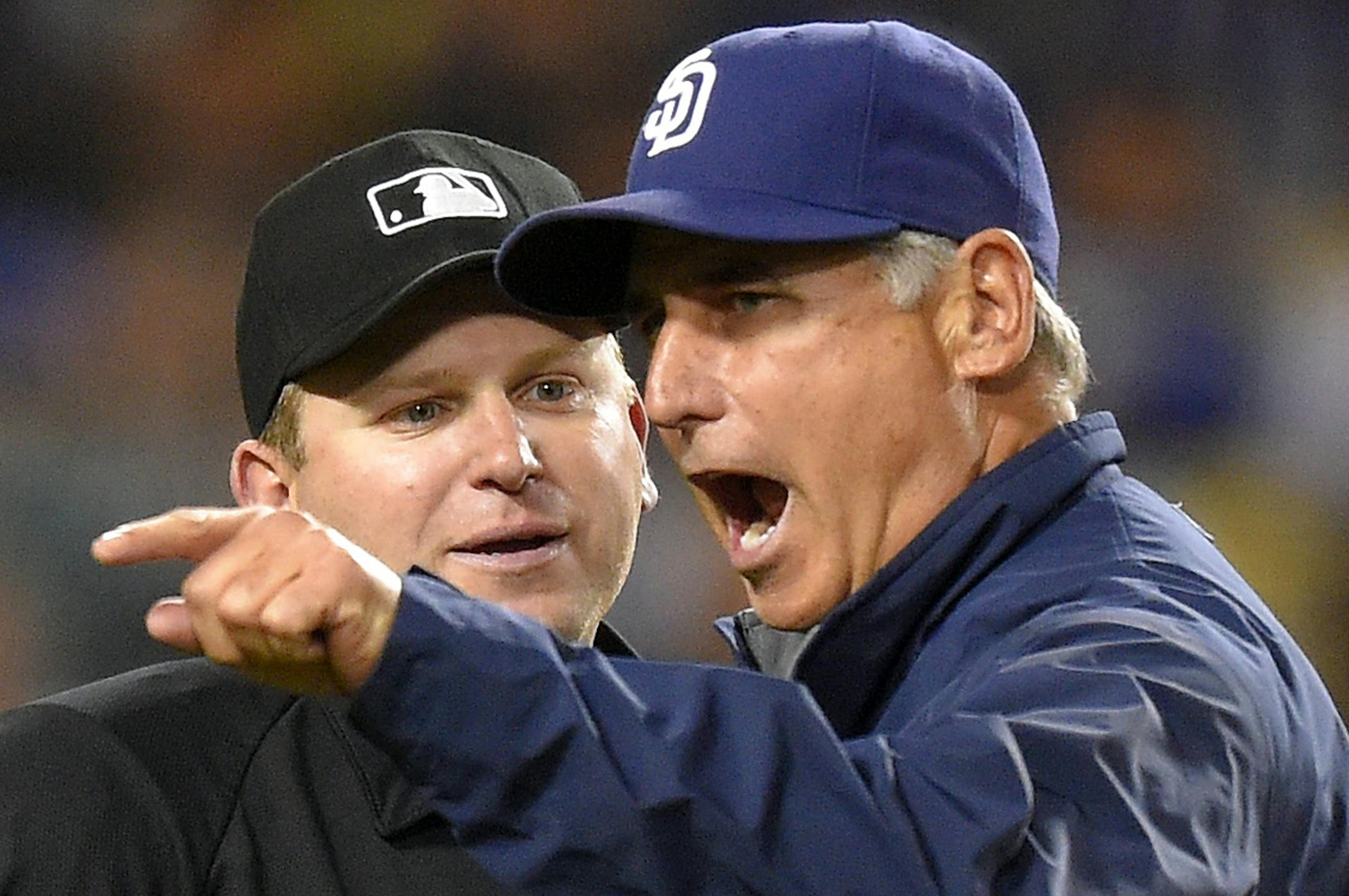 FILE - In this May 23, 2015, file photo, San Diego Padres manager Bud Black, right, argues a call with home plate umpire Clint Fagan during the eighth inning of a baseball game against the Los Angeles Dodgers in Los Angeles. The Padres fired Black on Monday, June 15, 2015, after hovering around .500 with a roster that was overhauled in the offseason. (AP Photo/Mark J. Terrill, File)