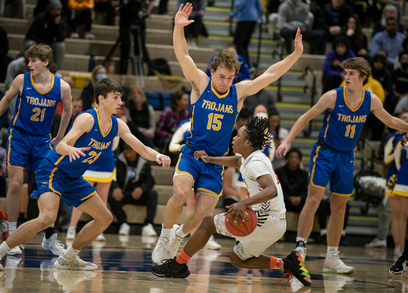 Jerome Williams Jr., of South High ,was pressured by Wayzata's Spencer Hall (23) and Drew Berkland ,(15), in Plymouth, Minn., on Tuesday, March 15, 2022.