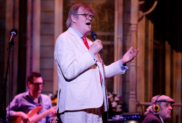 Garrison Keillor performs during the warmup to the live broadcast of "A Prairie Home Companion" at the State Theatre in Minneapolis on Saturday, May 2