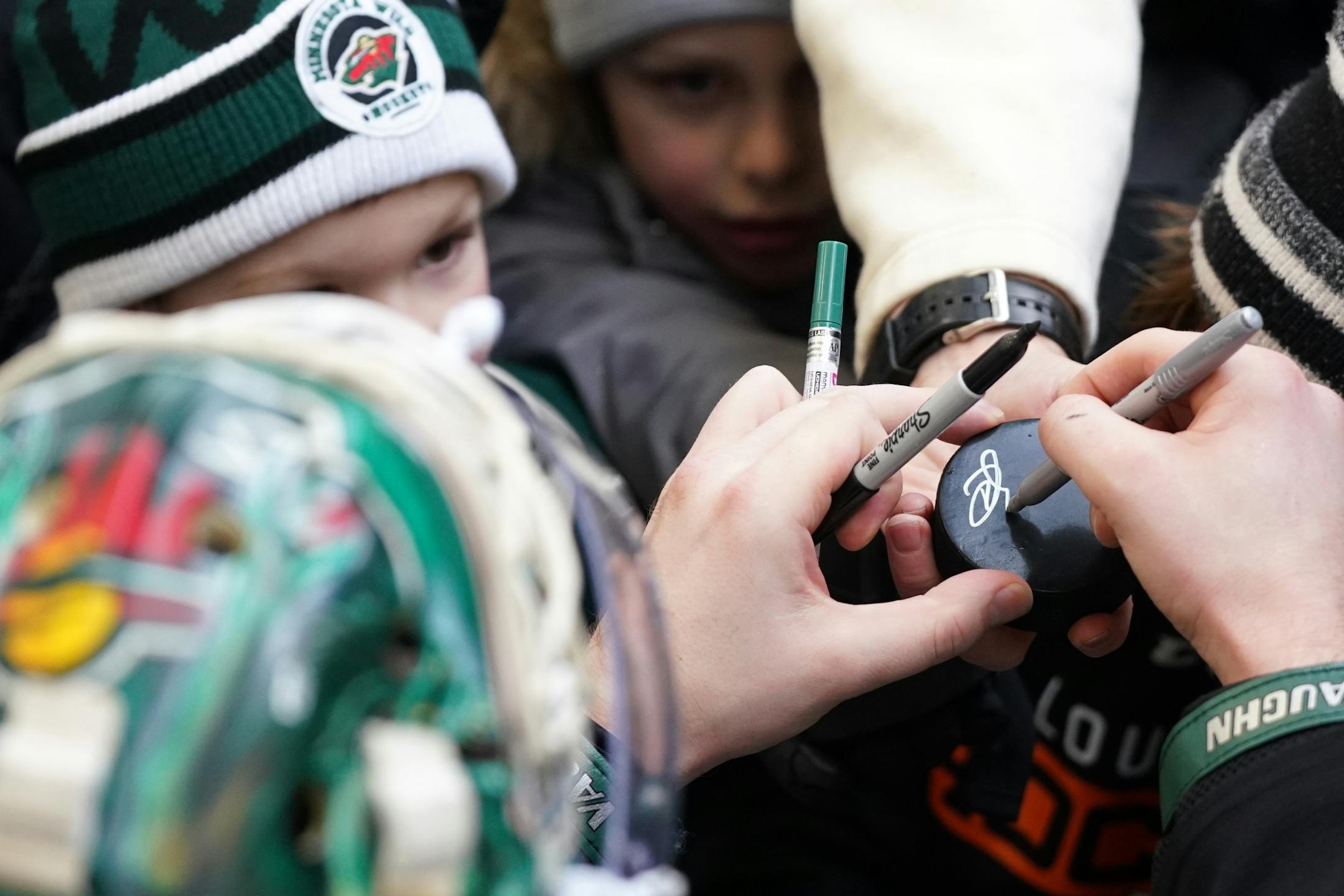 Minnesota Wild goaltender Devan Dubnyk (40) signed autographs following the Wild's outdoor practice Thursday.