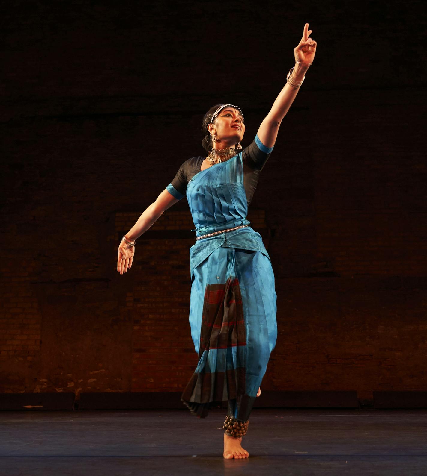 Choreographer/dancer Ashwini Ramaswamy performs in her work "Let the Crows Come." Photo by by Jake Armour.