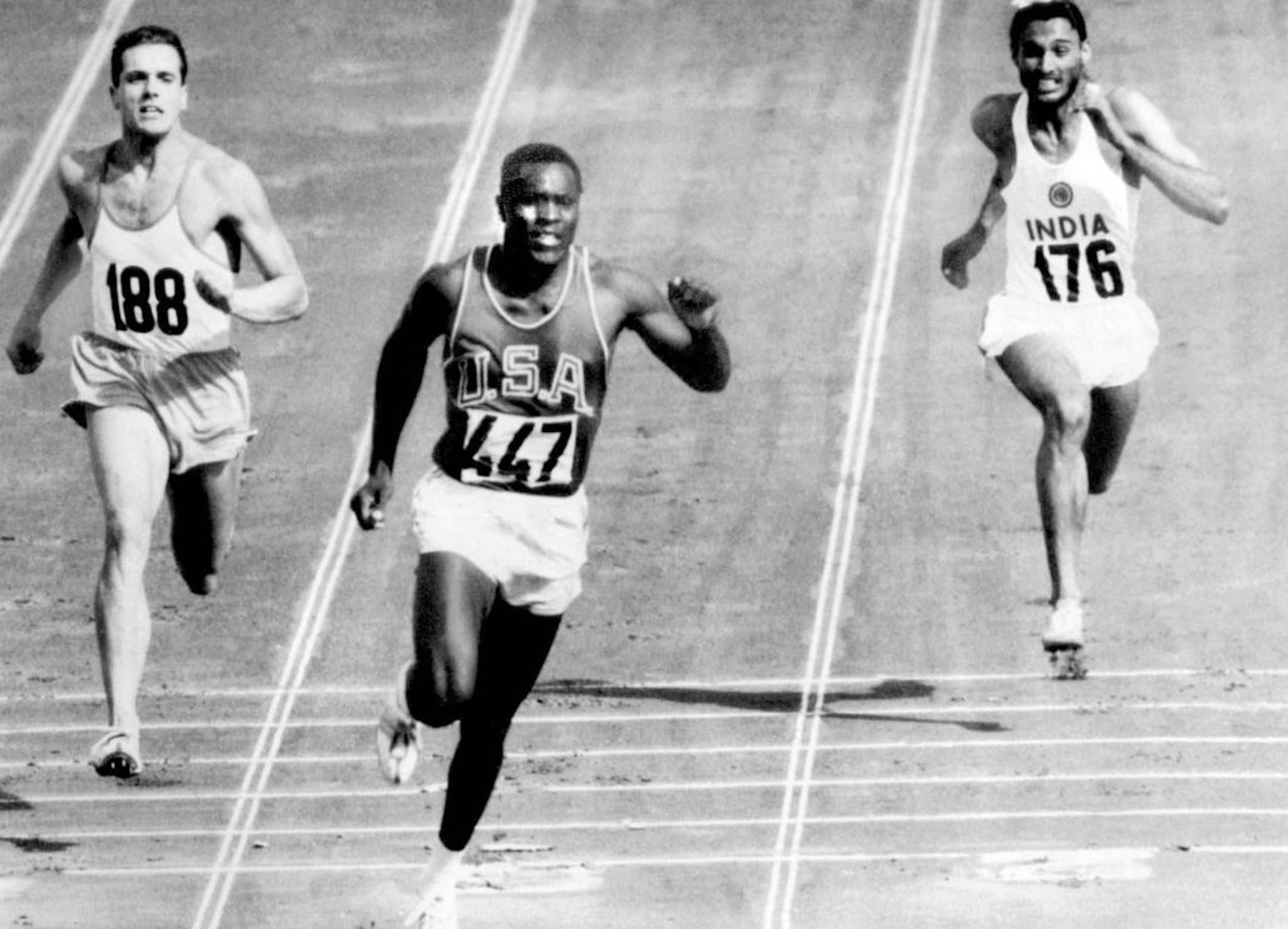 In this Sept. 5, 1960, file photo, Rafer Johnson of the United States, center, finishers the fourth heat of the decathlon 100 meter dash at the Olympics in Rome, Italy. Eef Kamerbeek of Netherlands is at left, and Gurbachan Singh Randhawa of India is at right. Rafer Johnson, who won the decathlon at the 1960 Rome Olympics and helped subdue Robert F. Kennedy's assassin in 1968, died Wednesday, Dec. 2, 2020. He was 86. He died at his home in the Sherman Oaks section of Los Angeles, according to fa