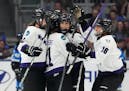 Minnesota's Sophia Kunin (11) celebrates her goal against Toronto with Lee Stecklein (2), Liz Schepers (21) and Sophie Jaques (16) during the third pe