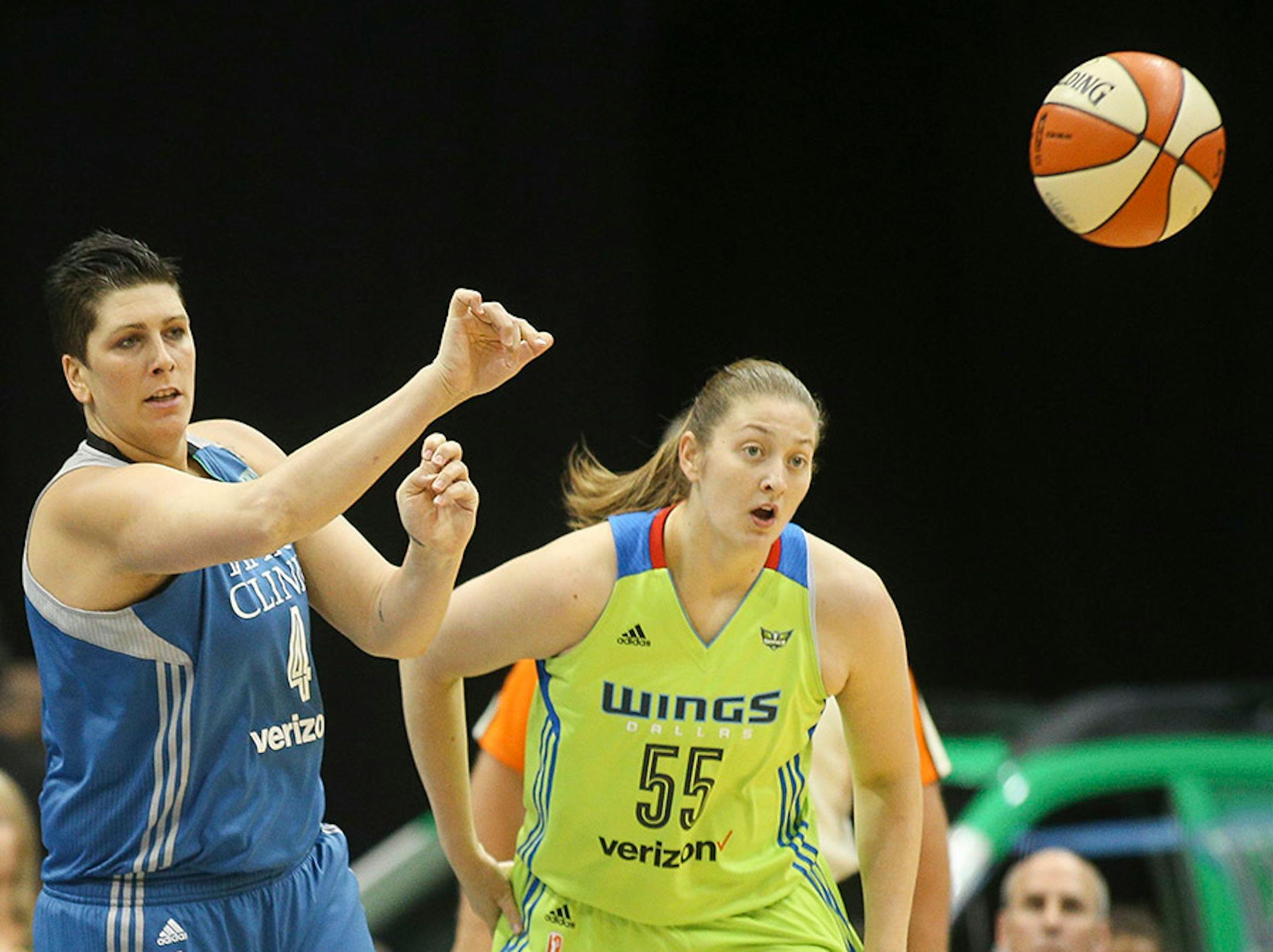 Minnesota Lynx center Janel McCarville (4) hurls a pass down court to Minnesota Lynx guard Lindsay Whalen (13).