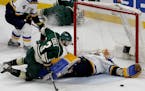 Charlie Coyle (3) could not get the puck past Blues goalie Jake Allen (34) as Eric Staal (12) crashed into the boards in the second period. Staal had 
