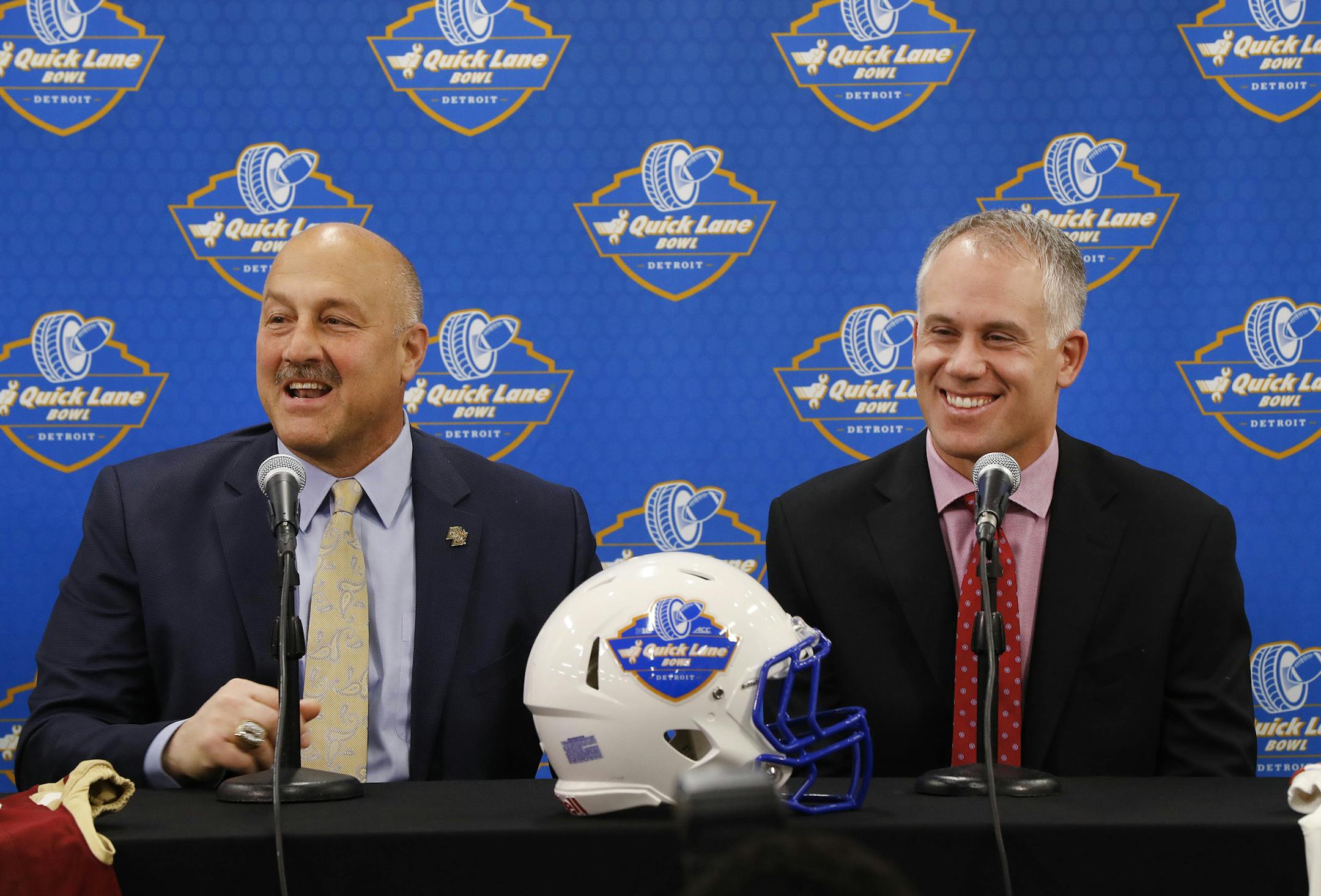 Boston College head coach Steve Addazio, left, and Maryland head coach DJ Durkin speak at a news conference previewing the NCAA college football Quick Lane Bowl in Allen Park, Mich., Wednesday, Dec. 7, 2016. (AP Photo/Paul Sancya)