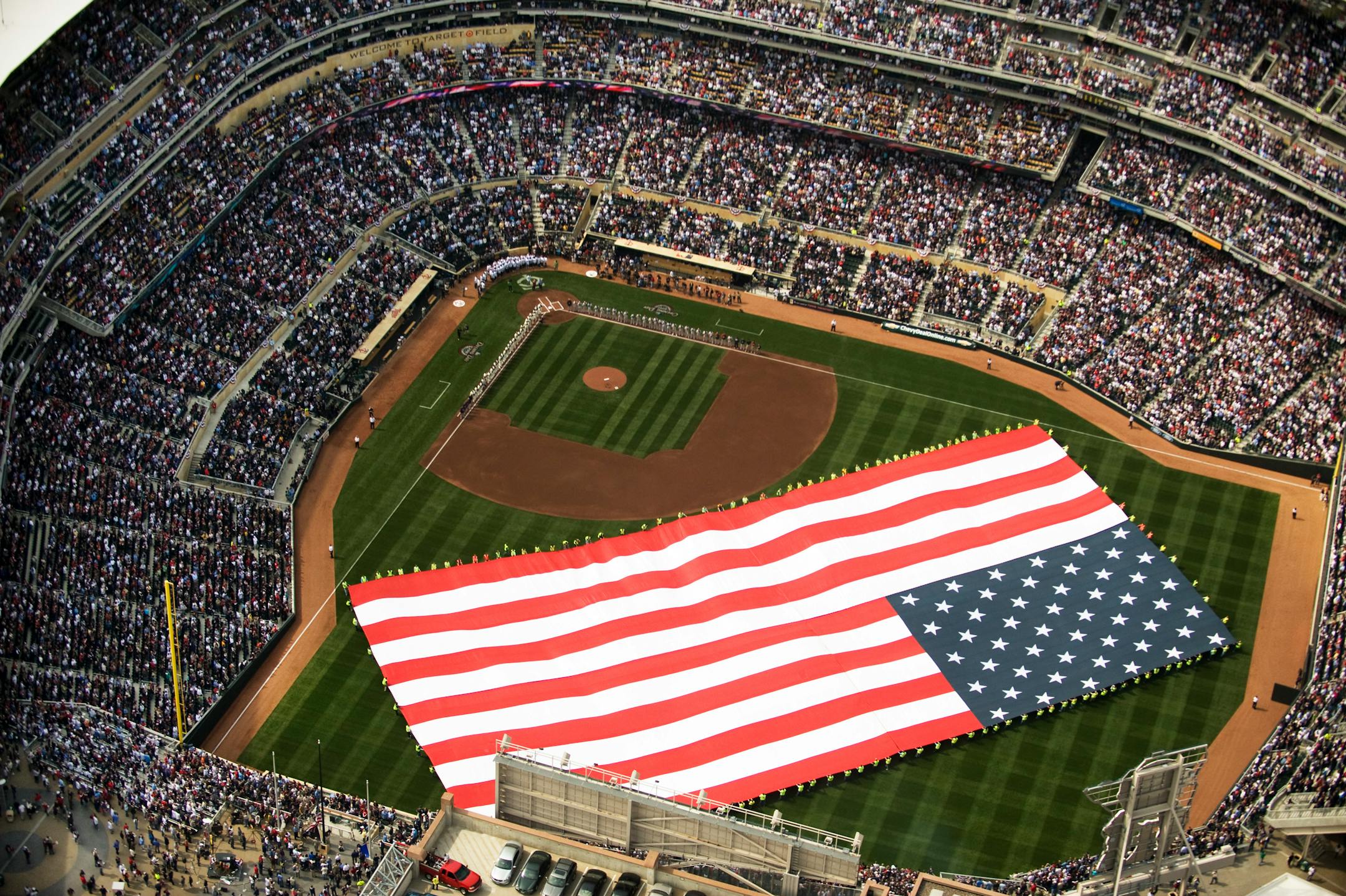 Pre-game display of the American flag on opening day of Target Field.