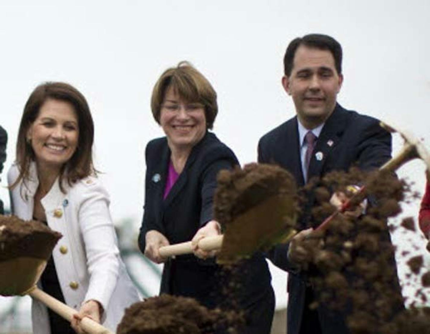 From left, U.S. Rep Michele Bachmann, U.S. Sen. Amy Klobuchar, both of Minnesota, with Wisconsin Gov. Scott Walker at the May groundbreaking for a new St. Croix River bridge.