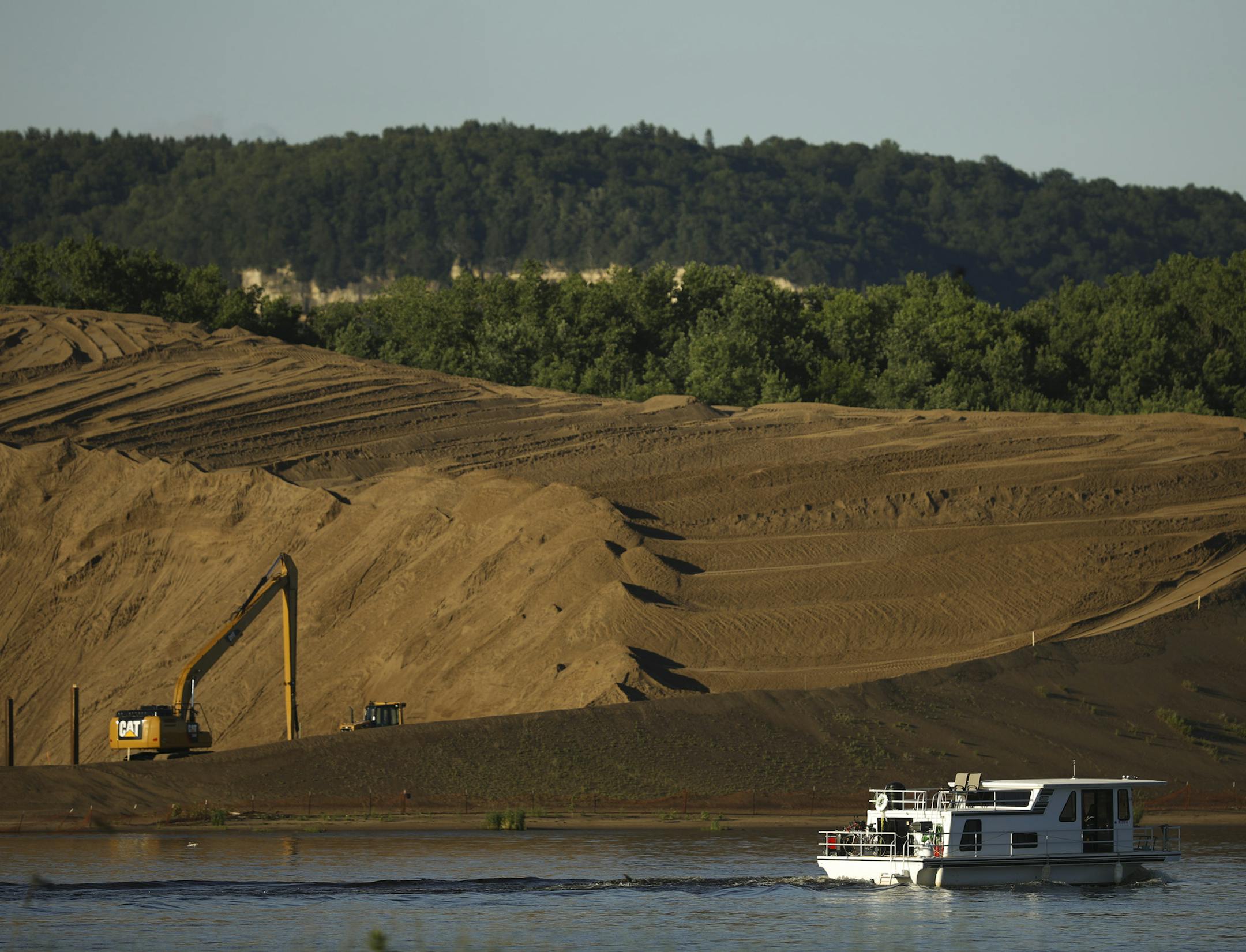 Sand dredged from the Mississippi River is piled high not far from Willard Drysdale's farm. ] JEFF WHEELER ï jeff.wheeler@startribune.com Willard Drysdale learned last month that the U.S. Army Corps of Engineers has chosen his farm as the best site to dump 7 million cubic yards of sand dredged from the Mississippi River over the next 40 years. He hoped to pass the farm on to his daughter, Chelsea. They were photographed Tuesday evening, June 20, 2017 at their farm in rural Kellogg.