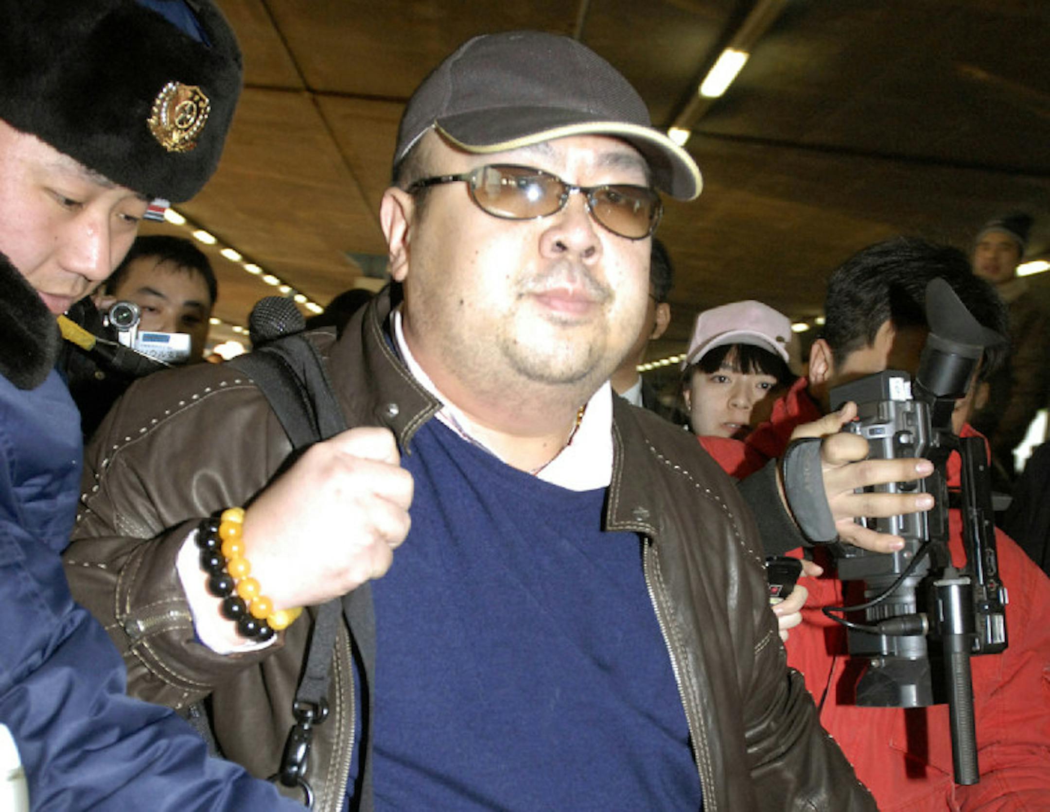 FILE - In this Feb. 11, 2007, file photo, a man believed to be Kim Jong Nam, eldest son of then North Korean leader Kim Jong Il, is surrounded by the media upon arrival from Macau at Beijing airport in Beijing.