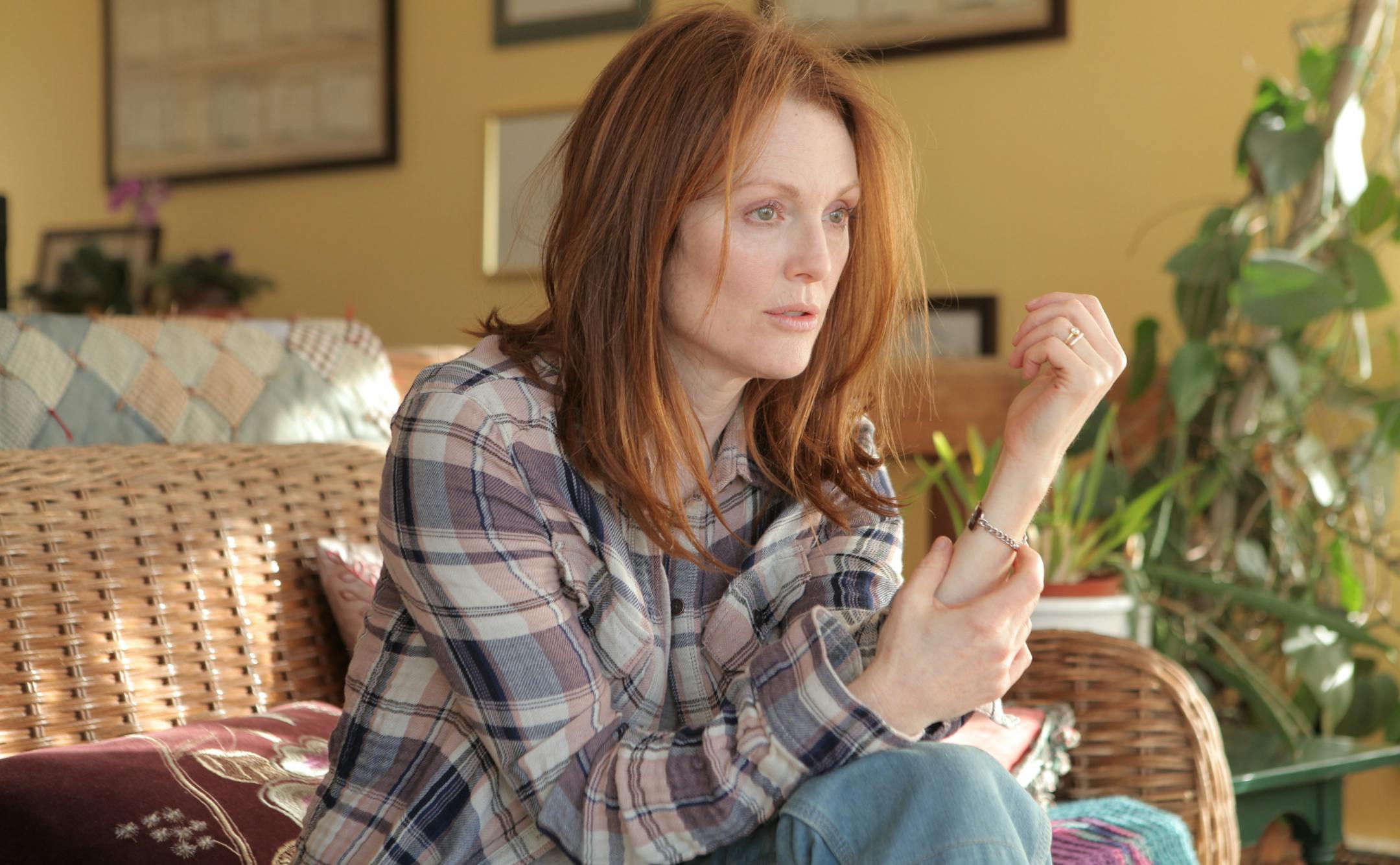 In this image released by Sony Pictures Classics, Julianne Moore appears in a scene from the film, "Still Alice." Moore was nominated for an Oscar Award for best actress on Thursday, Jan. 15, 2015, for her role in the film. The 87th Annual Academy Awards will take place on Sunday, Feb. 22, 2015 at the Dolby Theatre in Los Angeles. (AP Photo/Sony Pictures Classics, Linda Kallerus)