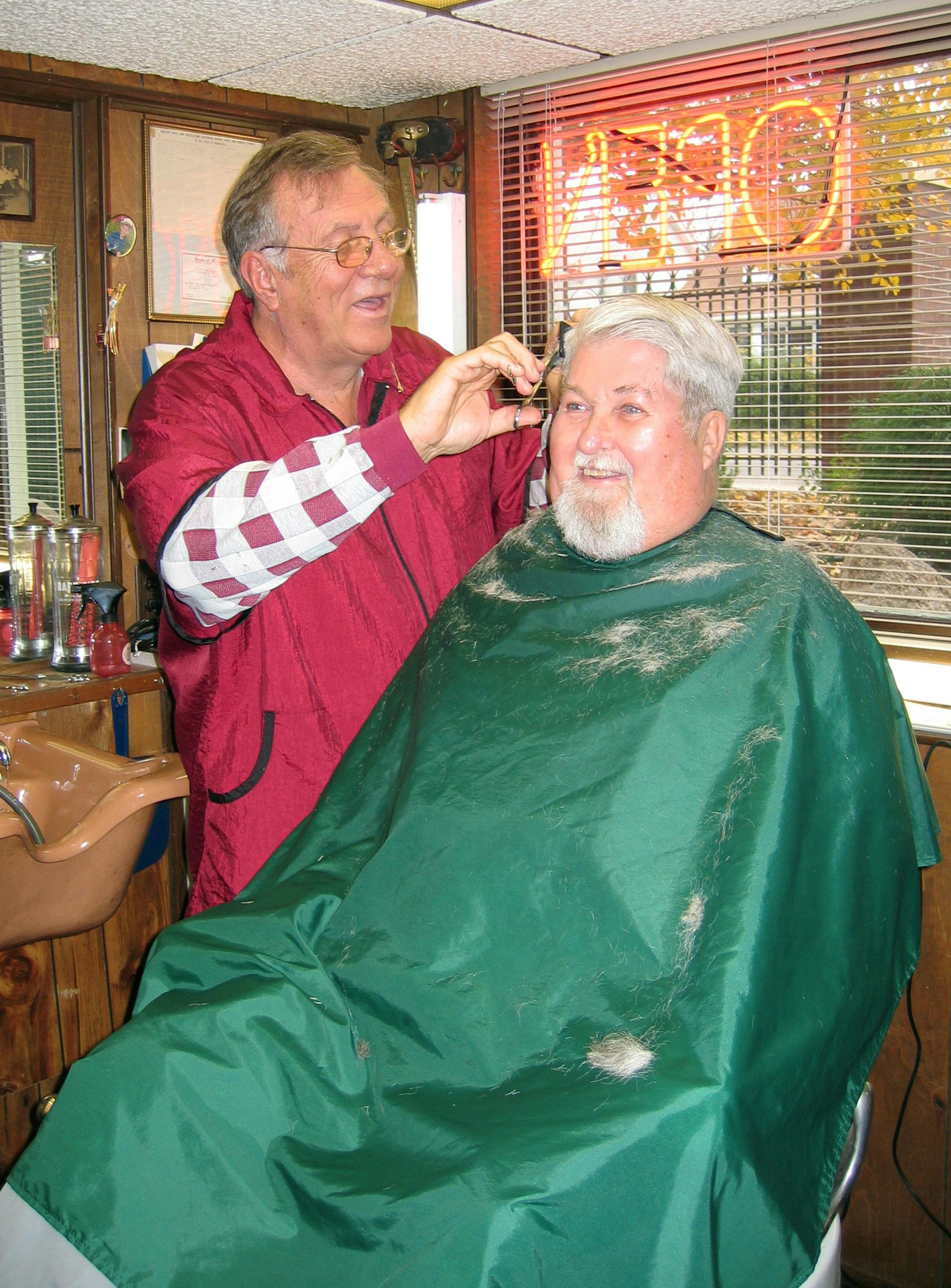 Richard Moynihan cut retired trucker Bob Hazelton's hair and talked politics. A recent flip of his 1878 Liberty Head silver dollar predicted Obama the winner, but Moynihan said his clients seem less certain.
