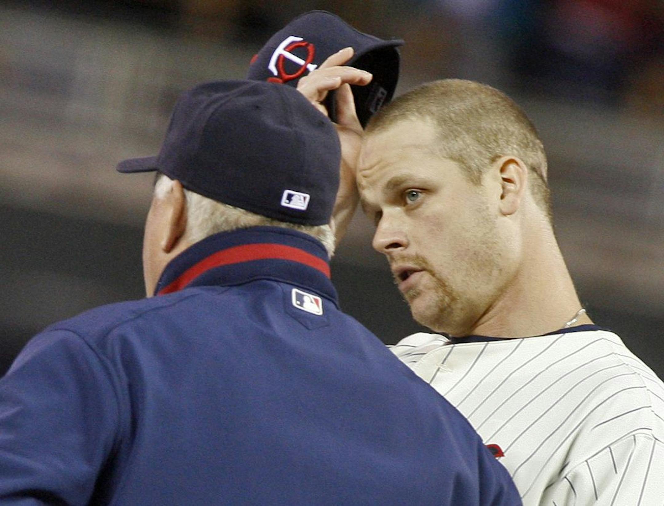 Twins first baseman Justin Morneau seemed to be showing some frustration as he stood at the mound with manager Ron Gardenhire as he changed pitchers in the 7th inning.