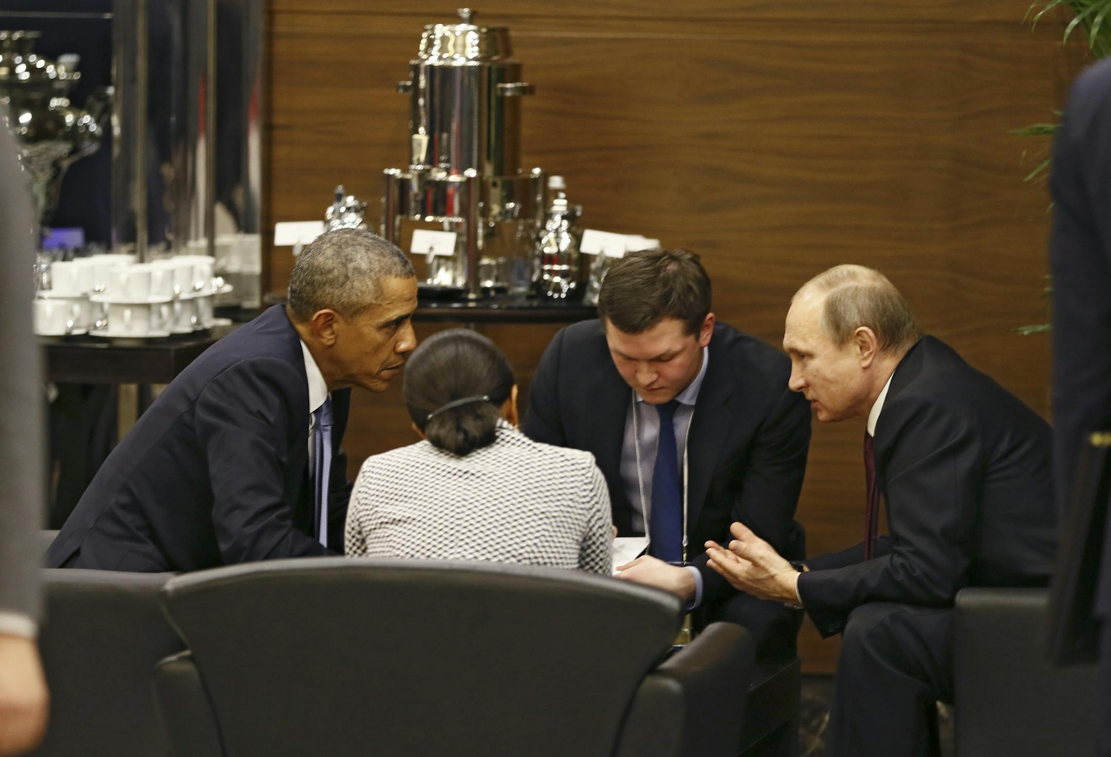 President Barack Obama, left, speaks with Russian President Vladimir Putin, right, before the opening session of the annual G-20 economic summit meeting, in Antalya, Turkey, Nov. 15 2015. White House officials said after the Paris terrorist attacks that Obama would spend a significant amount of time at the summit meeting in consultations with his counterparts about how to respond to the growing threat posed by the ISIS. (Cem Oksuz/Pool via The New York Times) -- FOR EDITORIAL USE ONLY --
