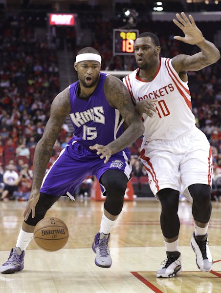 Sacramento Kings' DeMarcus Cousins (15) pushes against Houston Rockets' Tarik Black (10) in the first half of an NBA basketball game Wednesday, Nov. 2