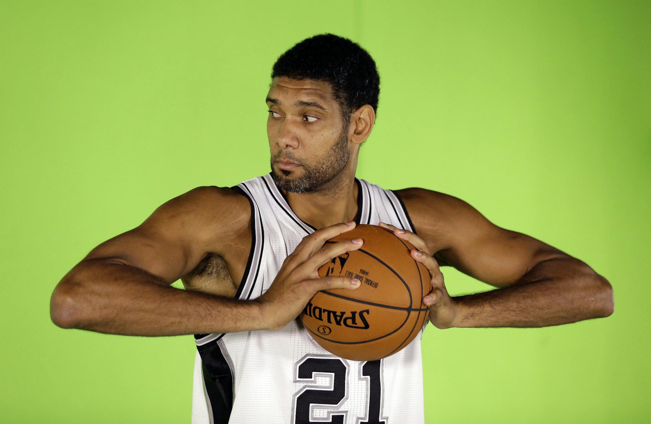 San Antonio Spurs' Tim Duncan poses for photos during an NBA basketball media day at the team's practice facility, Friday, Sept. 26, 2014, in San Antonio. (AP Photo/Eric Gay) ORG XMIT: OTK
