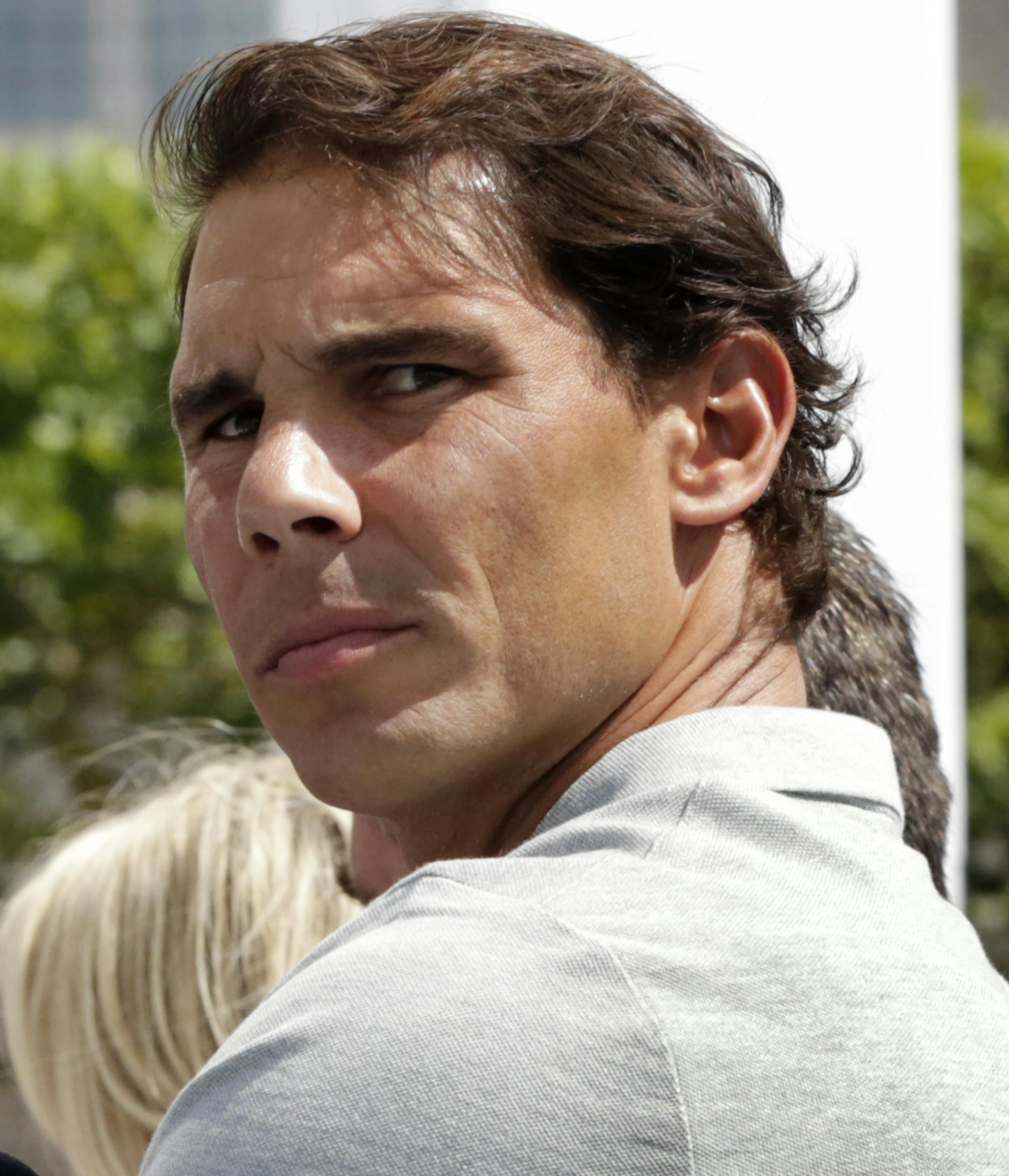 Defending champion Rafael Nadal participates in the reveal of the 2018 U.S. Open draw, in New York, Thursday, Aug. 23, 2018. (AP Photo/Richard Drew)