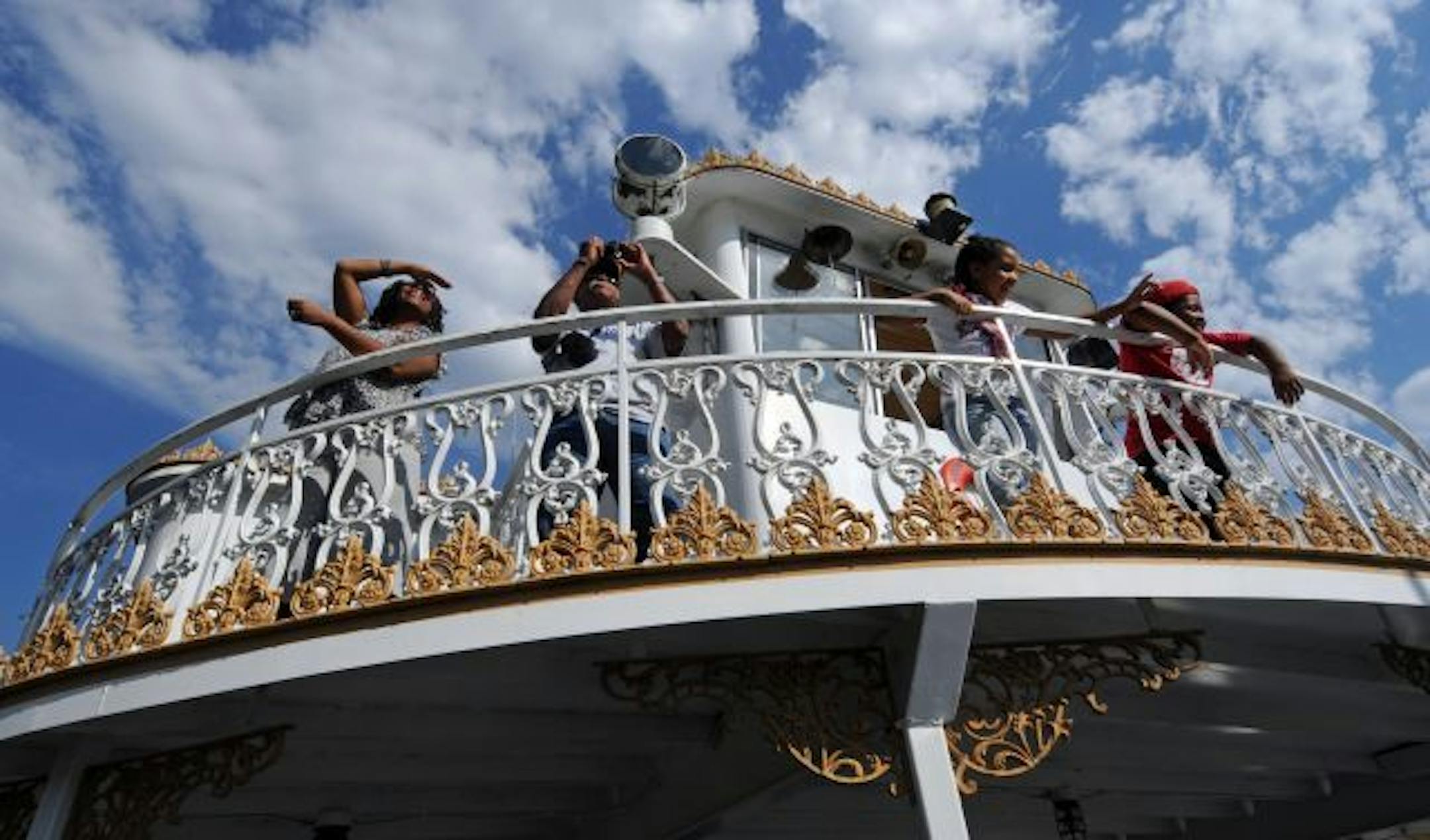 Members of the Pilgrim Baptist Church made a voyage of faith and remembrance on the Mississippi River. During the ride church members watched the shoreline near Fort Snelling.