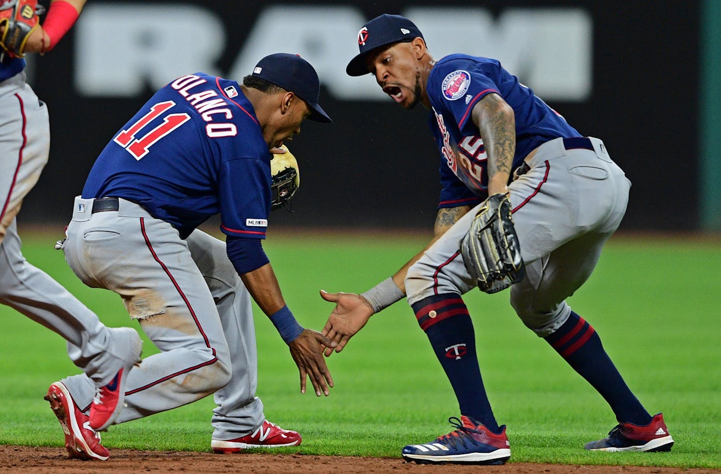 Byron Buxton and Jorge Polanco celebrate after defeating the Indians on Friday night.