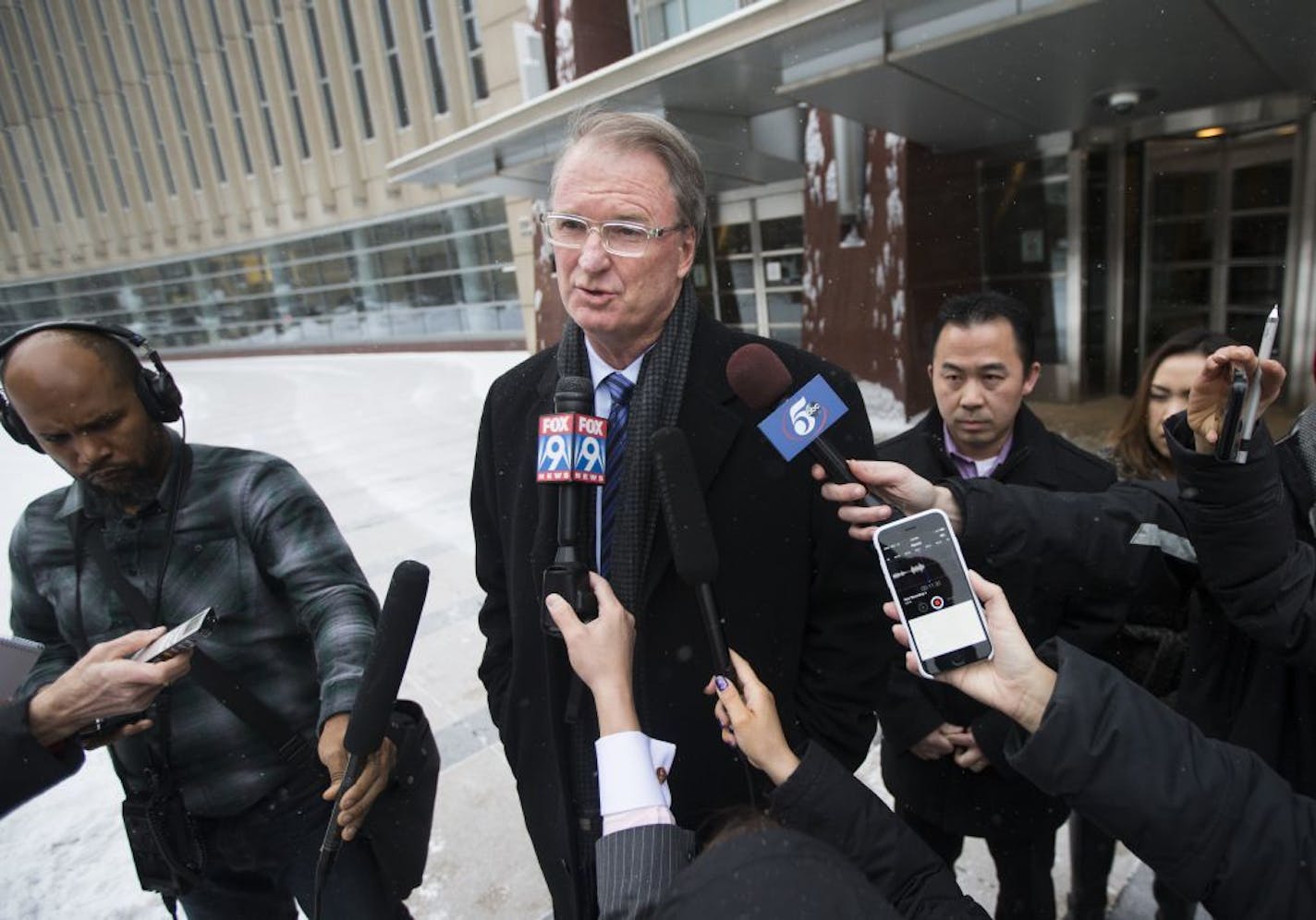 Koua Fong Lee's attorney Bob Hilliard spoke after a verdict in the Toyota liability trial that found the automaker 60 percent responsible and Lee 40 percent responsible for a 2006 crash that caused the deaths of three people and sent a St. Paul man to prison for more than two years, outside the Federal Courthouse in downtown Minneapolis, Minn. on Tuesday, February 3, 2015. Lee is at right.