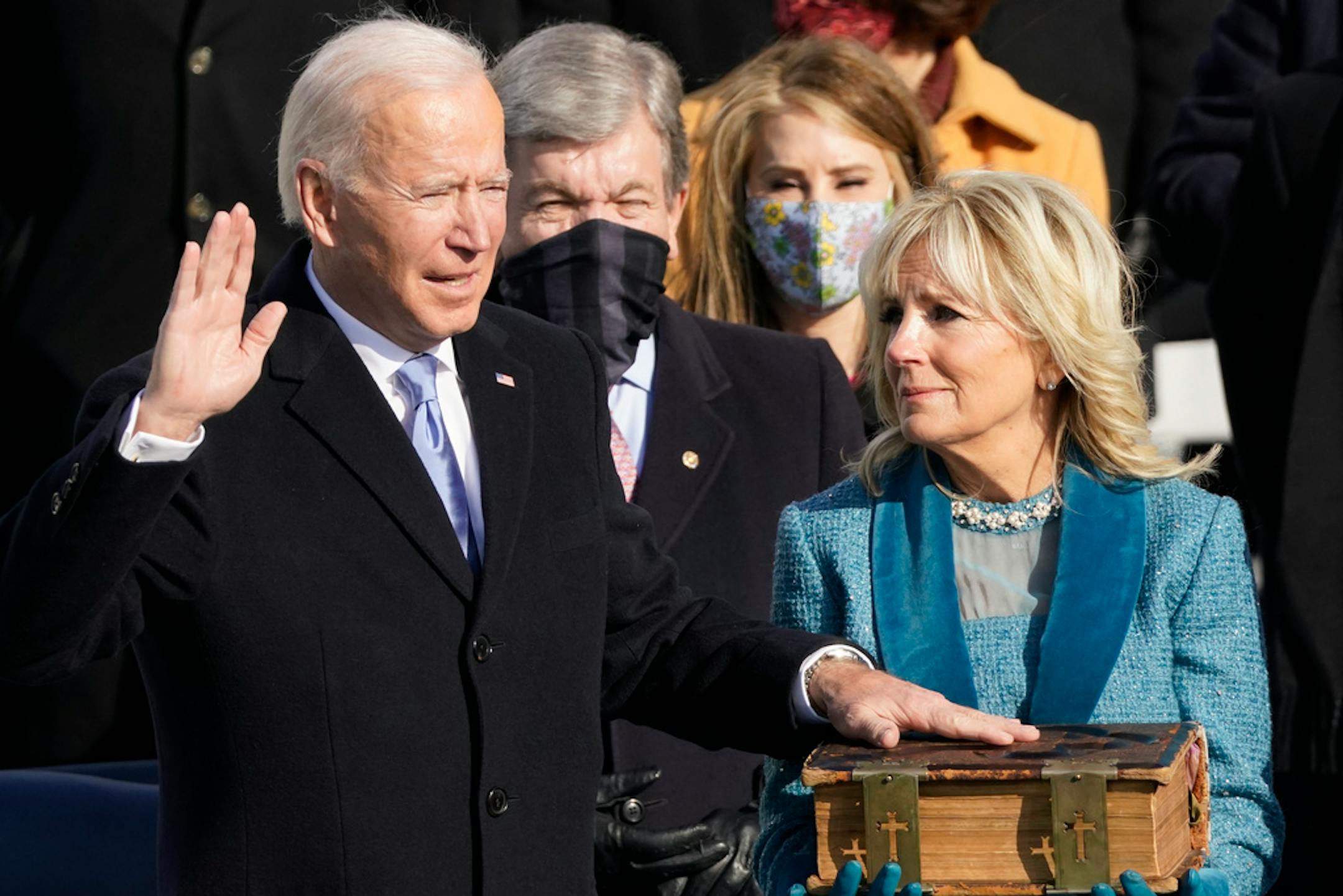 Joe Biden is sworn in as the 46th president of the United States by Chief Justice John Roberts as Jill Biden holds the Bible on Wednesday at the U.S. Capitol.