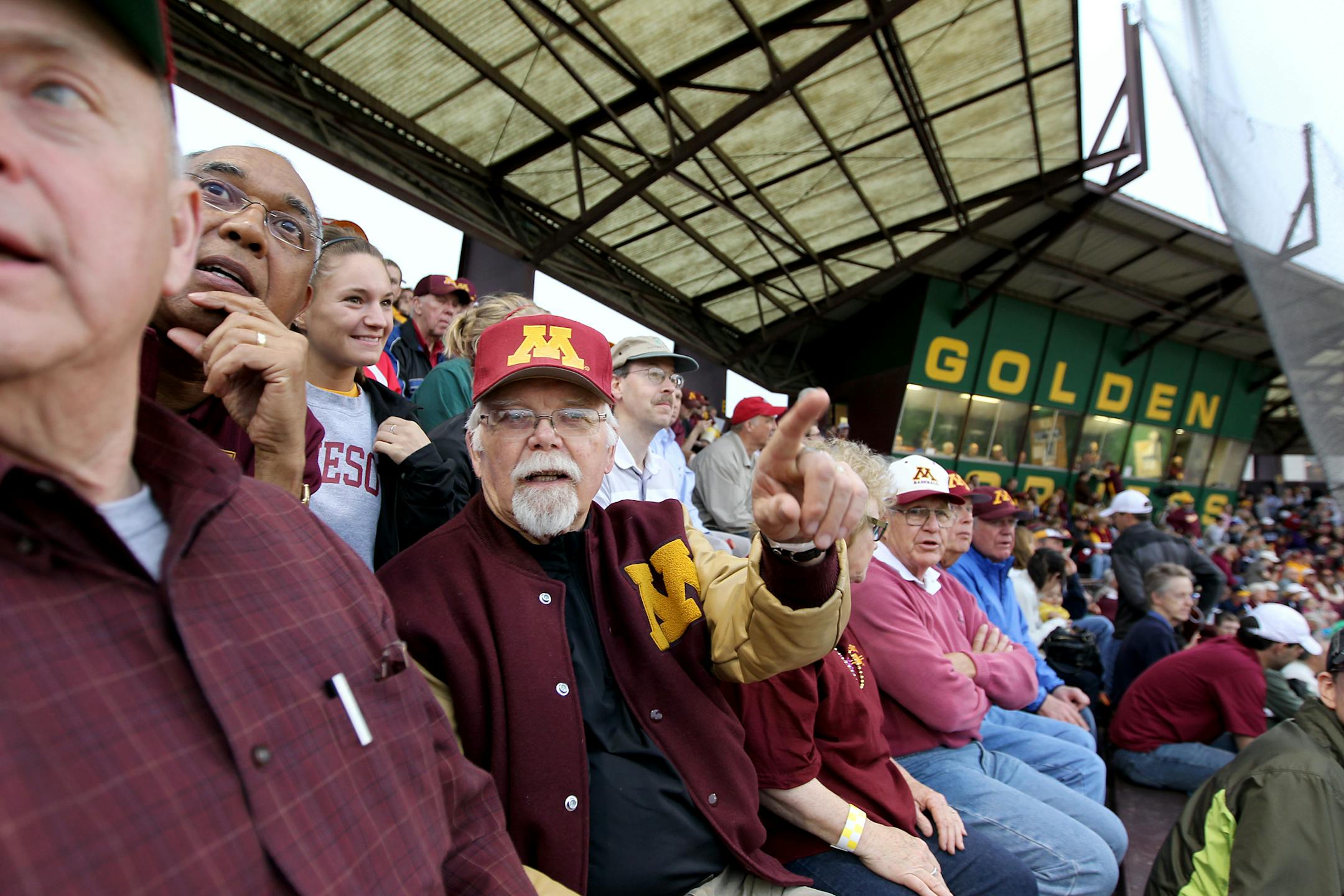 Dick Alford, third from left, of Mound, showed Gophers men's basketball coach Tubby Smith where the clubhouse used to be when he played for the Gophers on Delta Field in the 1960s. Alford and fellow former Gophers baseball players watched the final game at Siebert Field on Tuesday night.