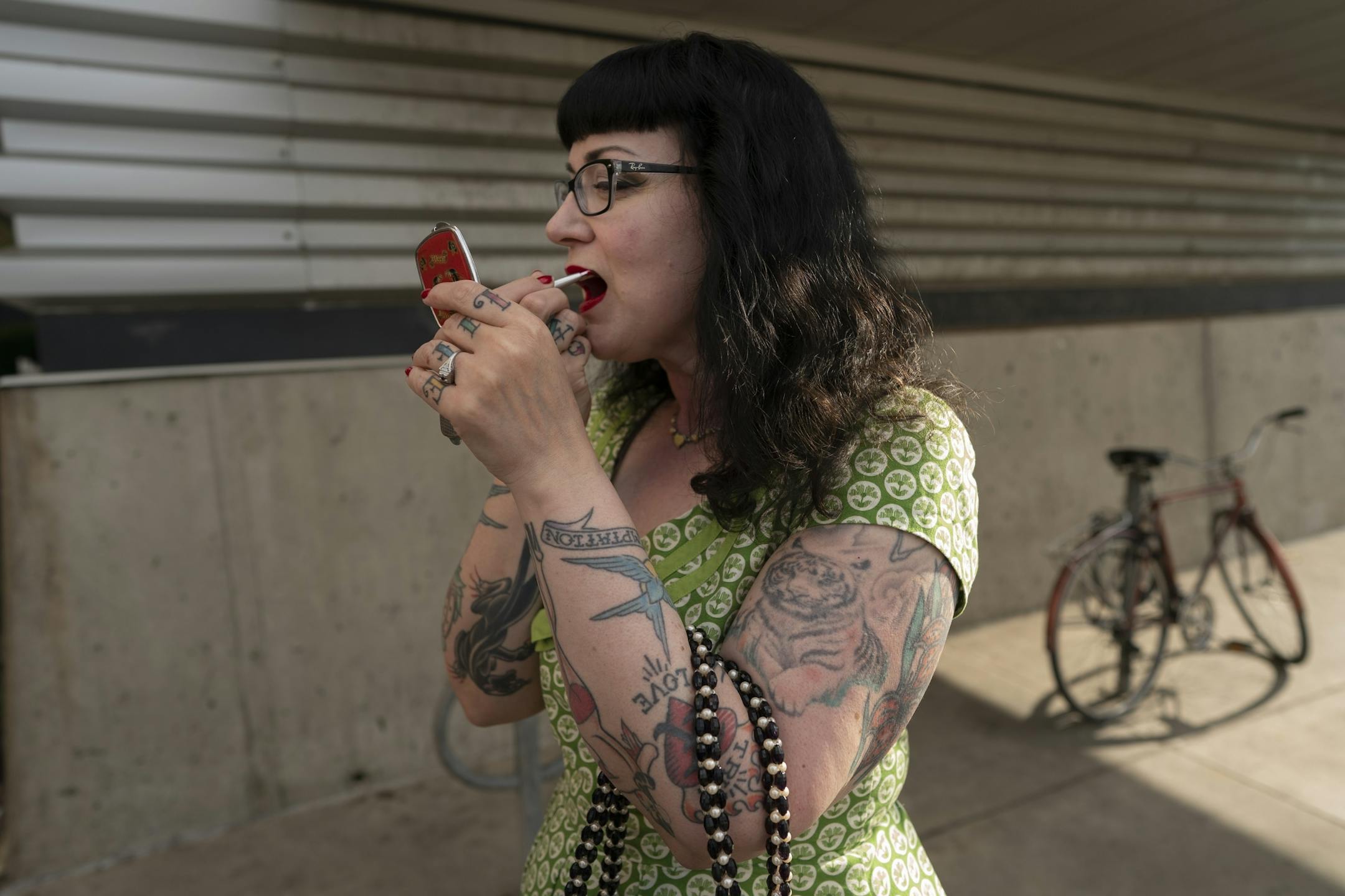 Melissa Peplinski put on her red lipstick as she and her husband Nat Peplinski of Hudson, WI, gathered with fans of Lee's Liquor Lounge to hear Dale Watson perform on the last of the club Tuesday May 14, 2019 in Minneapolis, MN.