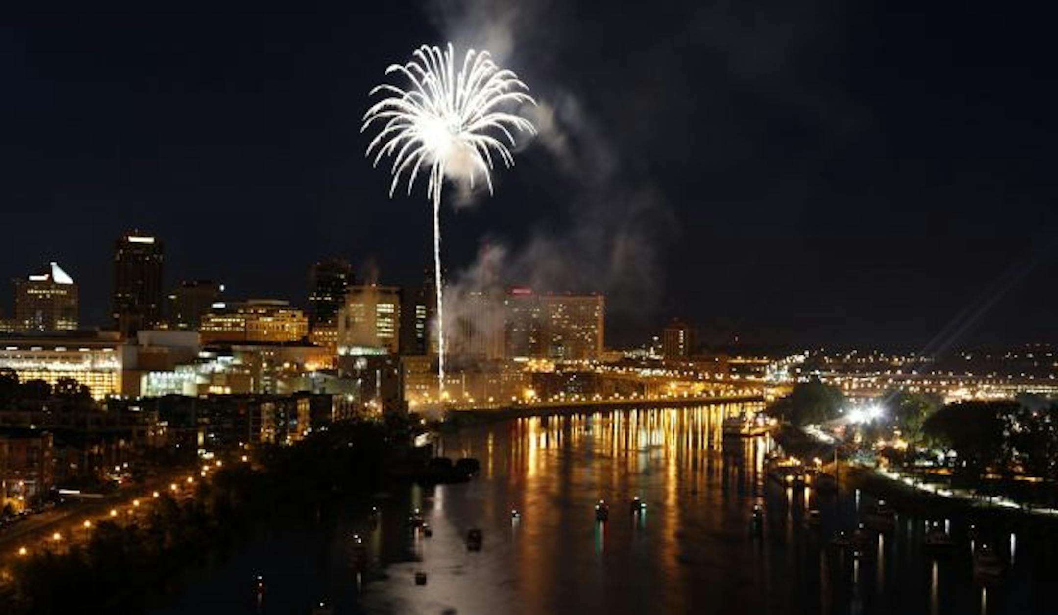 Fireworks light up the Mississippi River as patrons watch from both boats as well as the fair grounds during the 2009 Taste of Minnesota Thursday evening on Harriet Island in St. Paul.