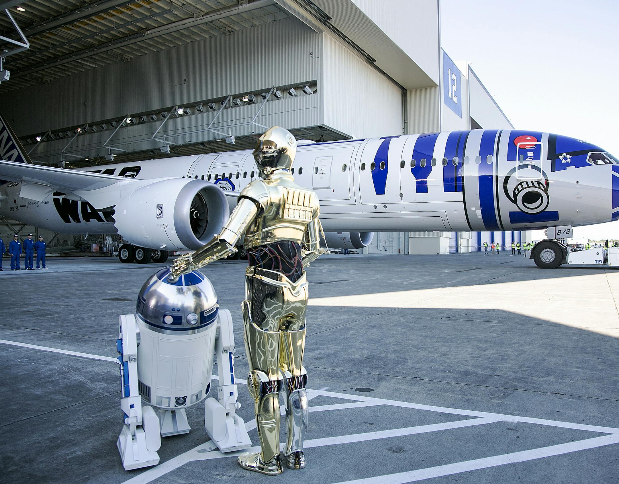 Star Wars characters R2-D2 and C-3PO attend the unveiling of the R2-D2-themed All Nippon Airways 787 airplane at Paine Field in Everett, Wash. on Saturday, Sept. 12, 2015. (Kevin Clark/The Daily Herald via AP)