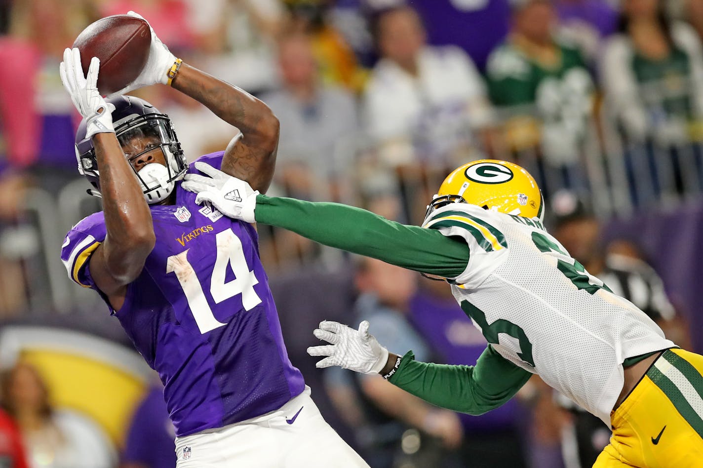 Stefon Diggs catches a TD pass from Sam Bradford last season.