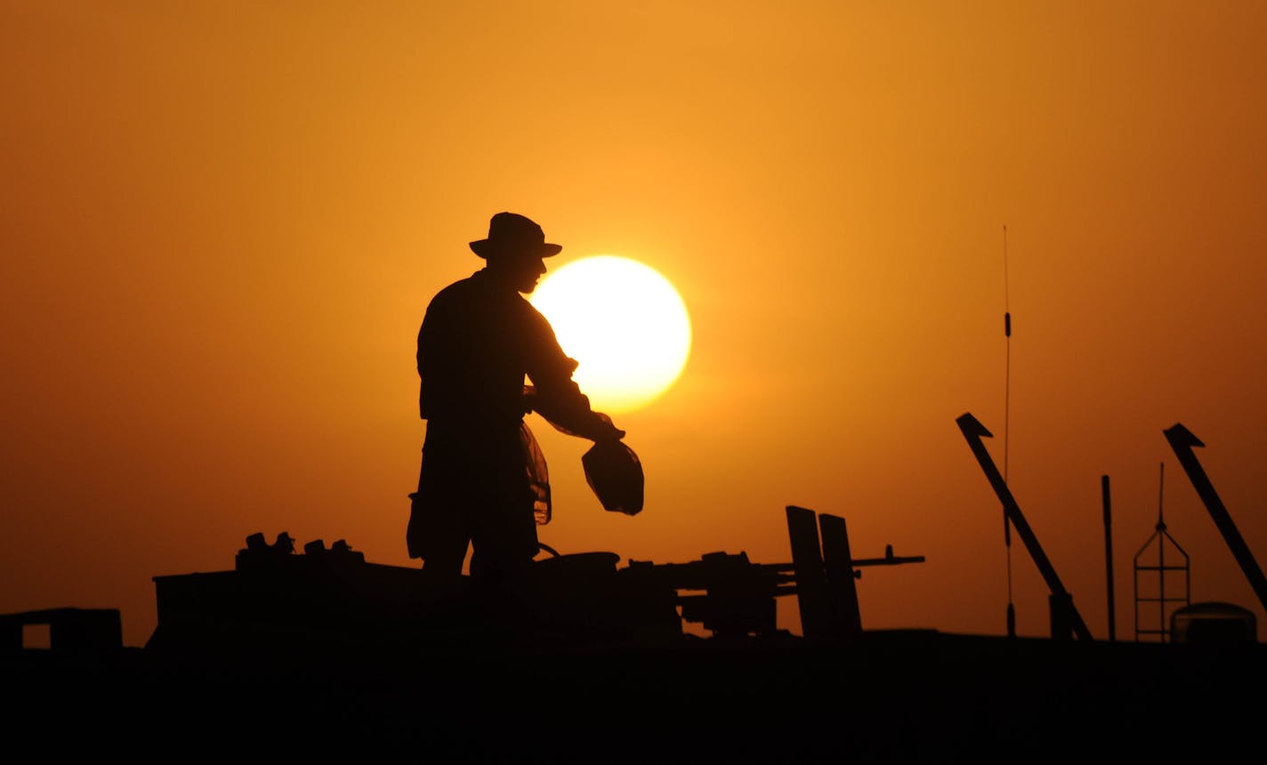 Richard Sennott&#xa5;rsennott@startribune.com] Helmand province Afghanistan 11/20/09 At the end of a 20 hr day a soldier stows gear away on the deck of a convoy gun truck . The 114th Transportation Company (114th TC) is a Minnesota Army National Guard Company headquartered in Duluth.This group of 187 soldiers provides ground transportation of mission essential supplies to coalition forces in forward operating bases or ( FOBS).It was a 3 mph 52-hour joint adventure between the British military an