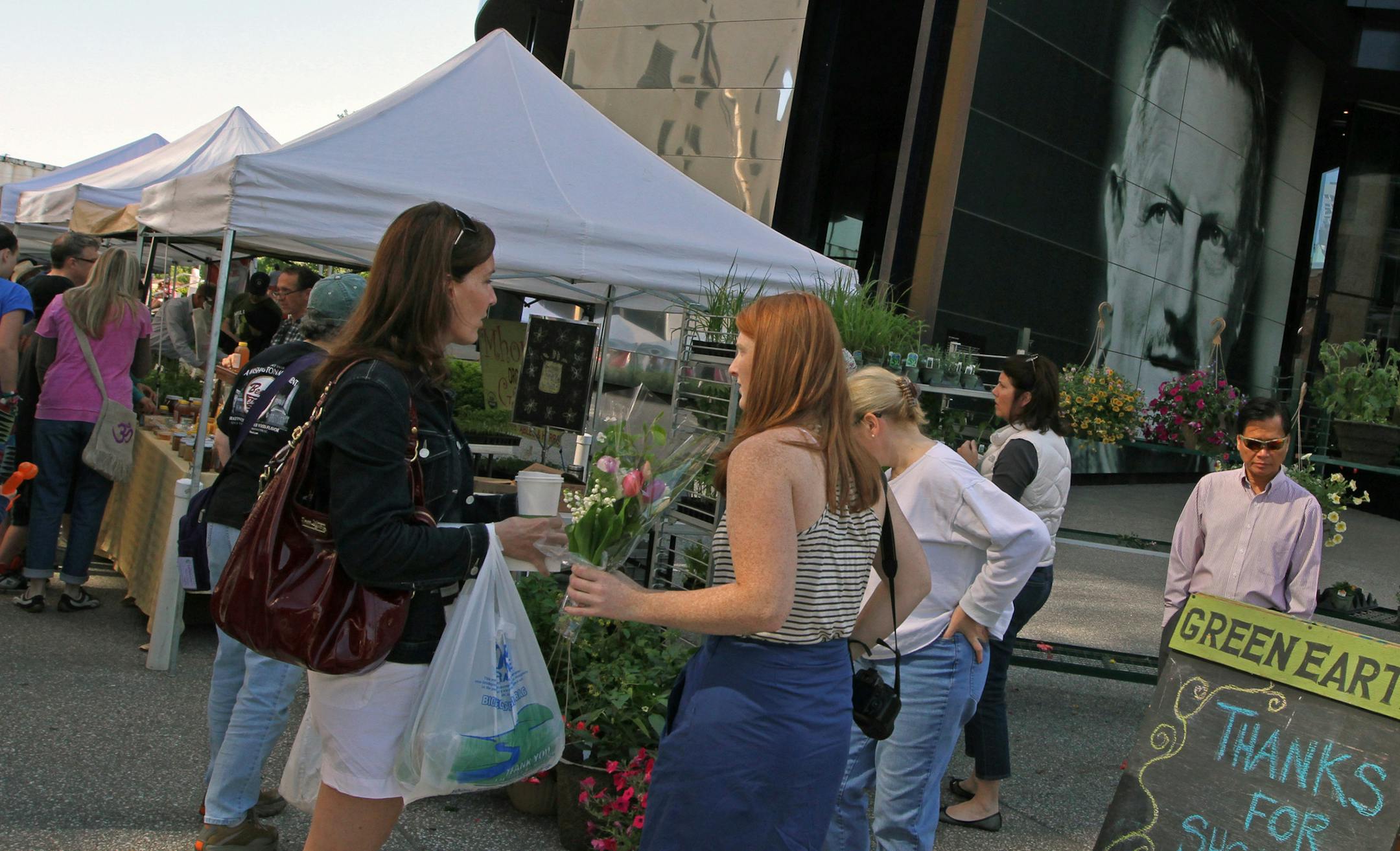 Thousands of people milled through booths of flowers and food during the Opening Day at Mill City Farmers Market, located next to the Guthrie Theater, on 5/12/12.] Bruce Bisping/Star Tribune bbisping@startribune.com