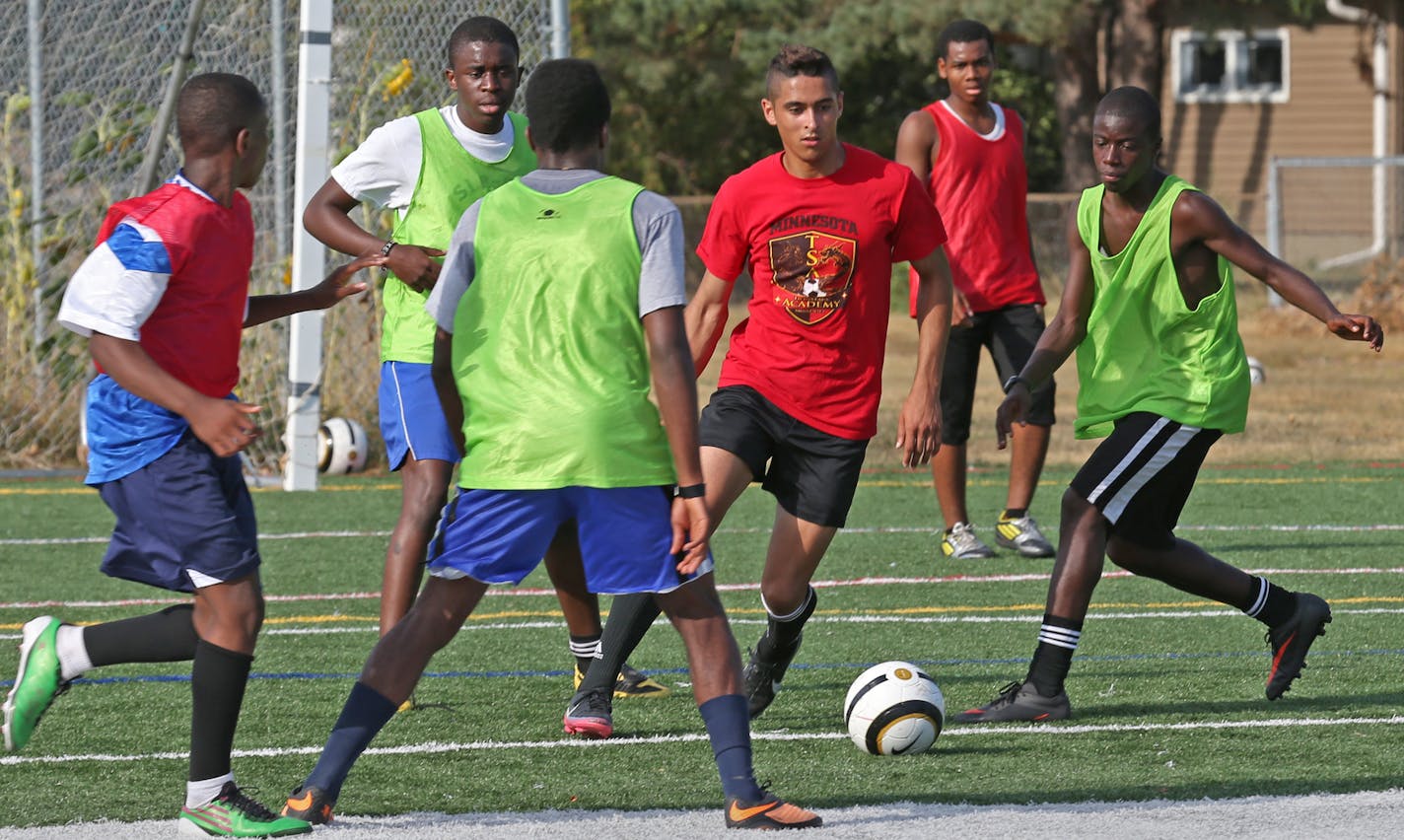 (center) Prairie Seeds Academy soccer player Mounir Peterson-Darbaki brought the ball up field during practice at the school on 9/6/13. Prairie Seeds Academy is attempting to rebrand its athletics with a new athletic director and new direction, espeically in soccer. The boys' soccer program has been tangled up in controversy over each of the last three years and was disqualified from last year's state tournament.] Bruce Bispng/Star Tribune bbisping@startribune.com Mounir Peterson-Darbaki/source.