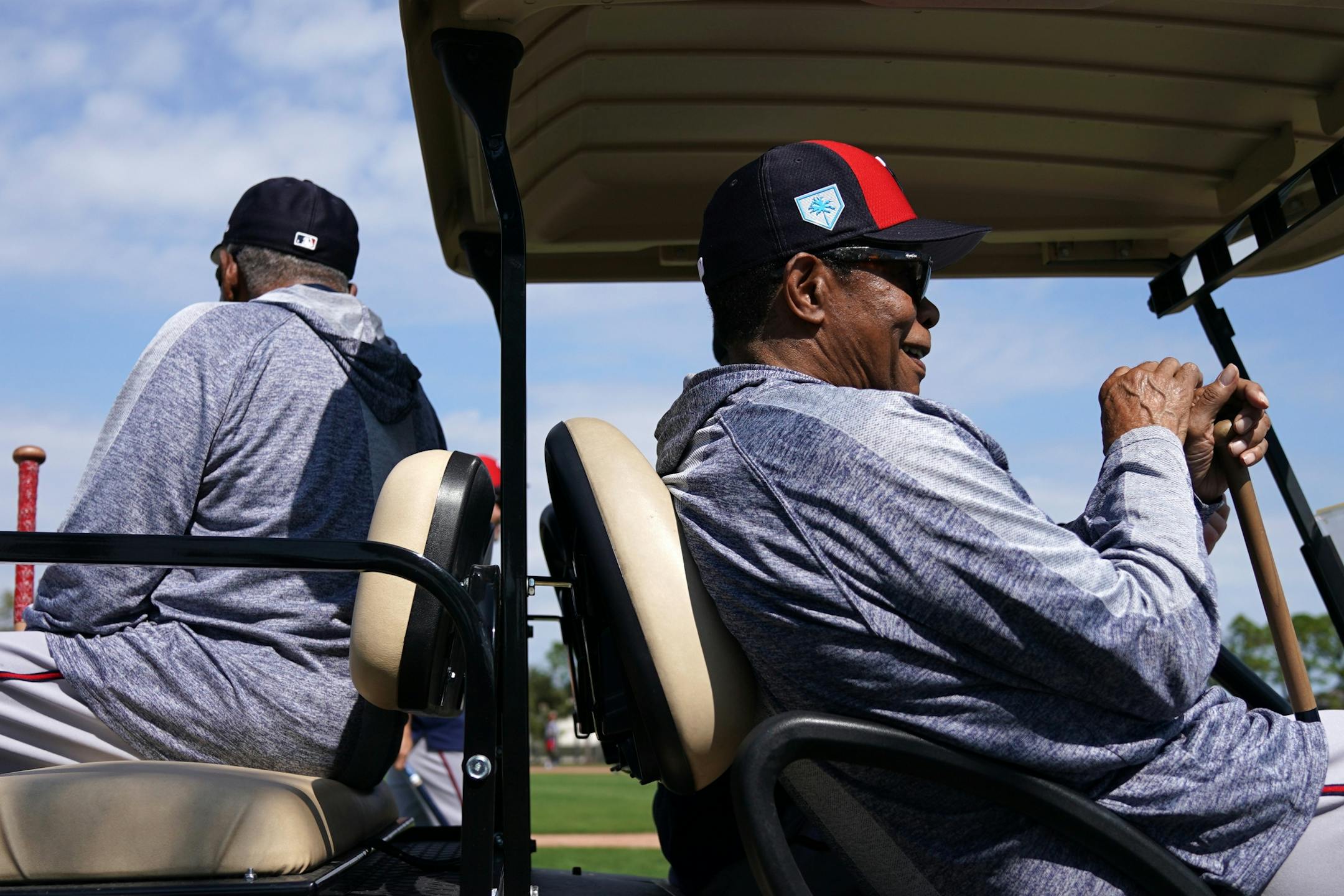 Minnesota Twins hall of famer Rod Carew smiled as he was driven back to the clubhouse in a golf cart after watching morning workouts with the few field players present at Spring Training Saturday.