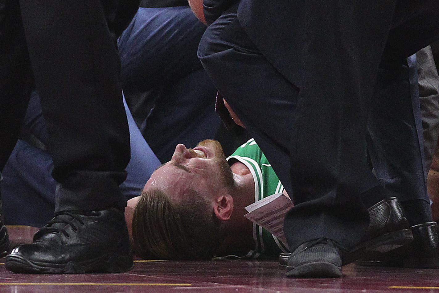 Boston Celtics forward Gordon Hayward lays out the ground while medics check his injury after a play against the Cleveland Cavaliers in the first quarter on Tuesday, Oct. 17, 2017, at Quicken Loans Arena in Cleveland. (Leah Klafczynski/Akron Beacon Journal/TNS)