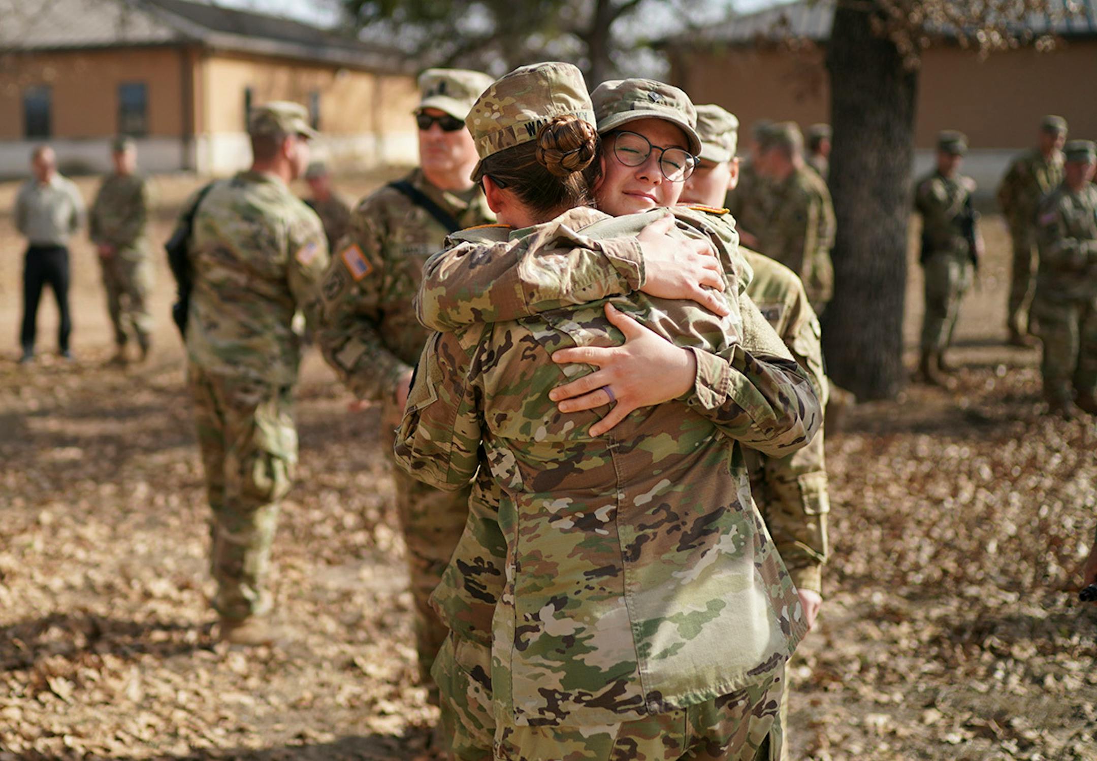 Spc. Nicole Cavanaugh hugged Maj. Amanda Waldusky after a memorial ceremony in North Fort Hood.