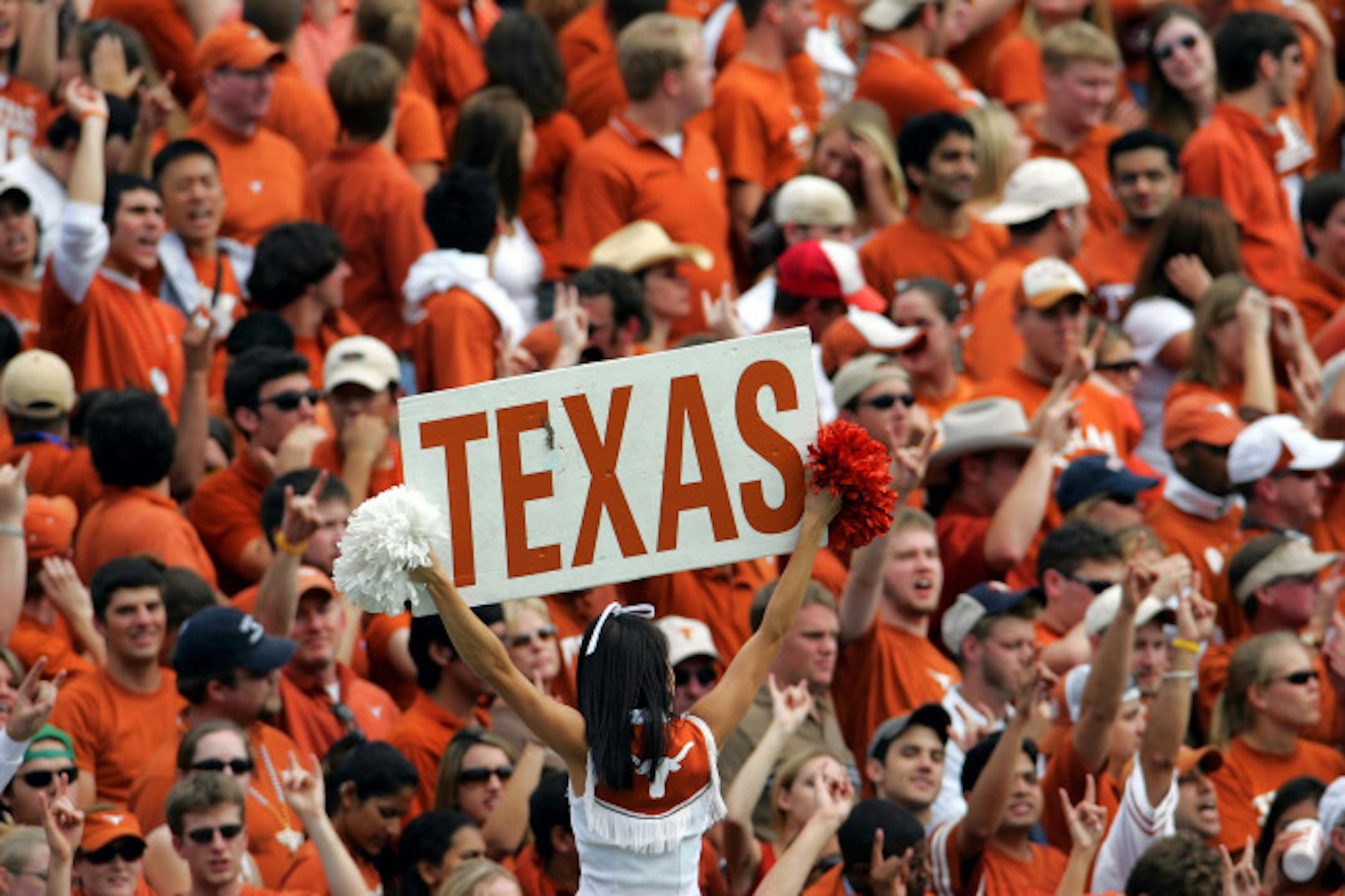 DALLAS - OCTOBER 8: Fans cheer for the Texas Longhorns during the game against the Oklahoma Sooners on October 8, 2005 at the Cotton Bowl in Dallas, Texas. The Longhorns defeated the Sooners 45-12.
