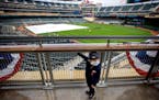 Thomas Christensen, 2, of Savage looked back at his father Drew after taking in the scene at Target Field for Twins opener.