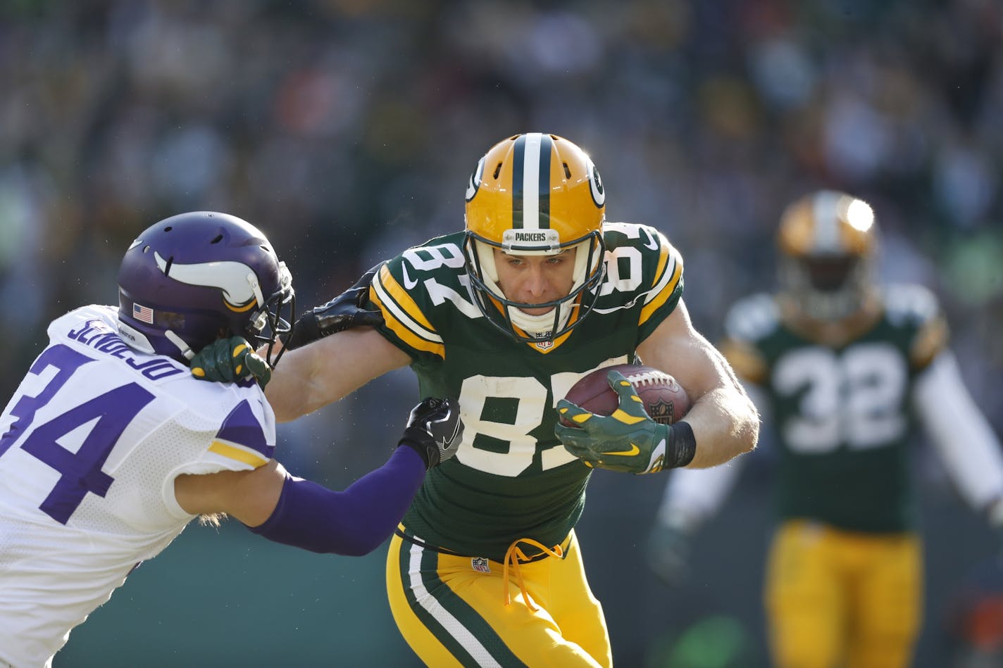 Green Bay Packers wide receiver Jordy Nelson (87) picked up a first down in the second quarter over Minnesota Vikings strong safety Andrew Sendejo (34) at Lambeau Field Saturday December 24,2016 in Green Bay, Wis.