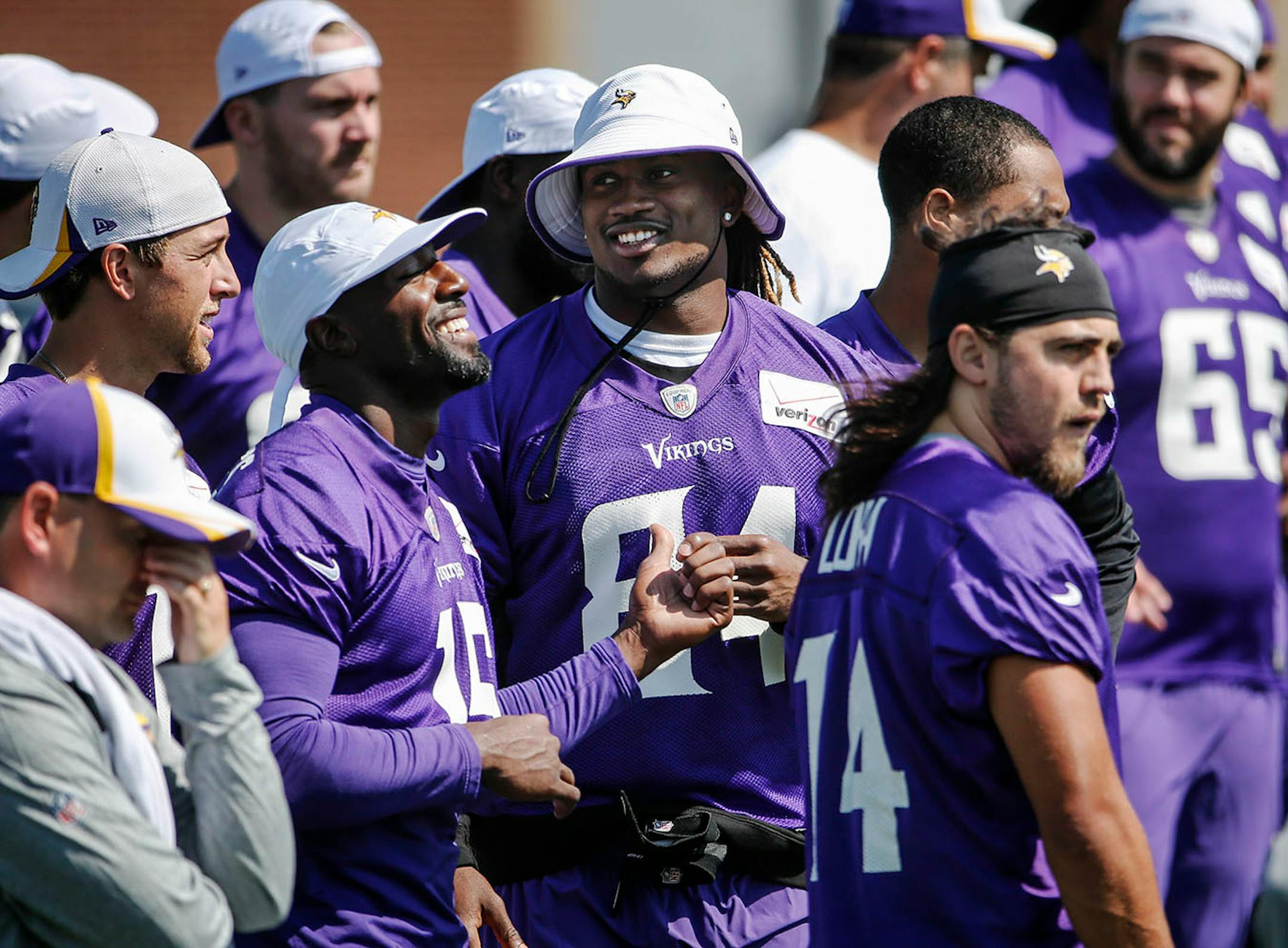 Minnesota Vikings receivers Greg Jennings (15) and Cordarrelle Patterson (84) appear happy to be back at training camp Friday, July 25, 2014, at Mankato State University in Mankato, Minn.