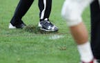 Officials attempted to repair damaged turf after a rough play in the fourth quarter.