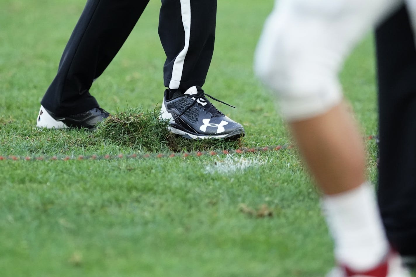 Officials attempted to repair damaged turf after a rough play in the fourth quarter.