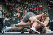 Mounds View's Quin Morgan (top) holds an advantage against Prior Lake's Brock Zurn during the Class 3A state championships.